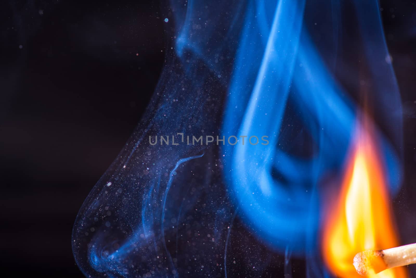 Match with smoke and fire on black background  copyspace by skrotov