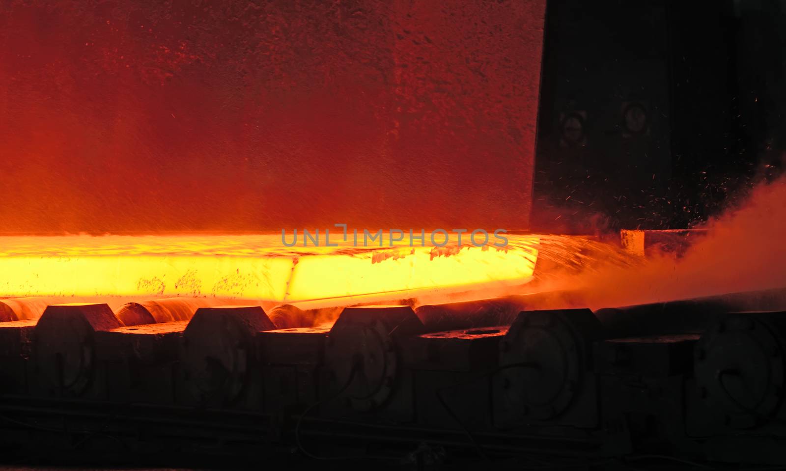 Hot steel on conveyor.production at steel mill