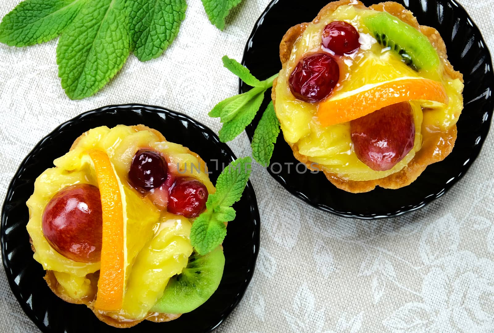 Cakes with slices of fresh fruit. by leventina