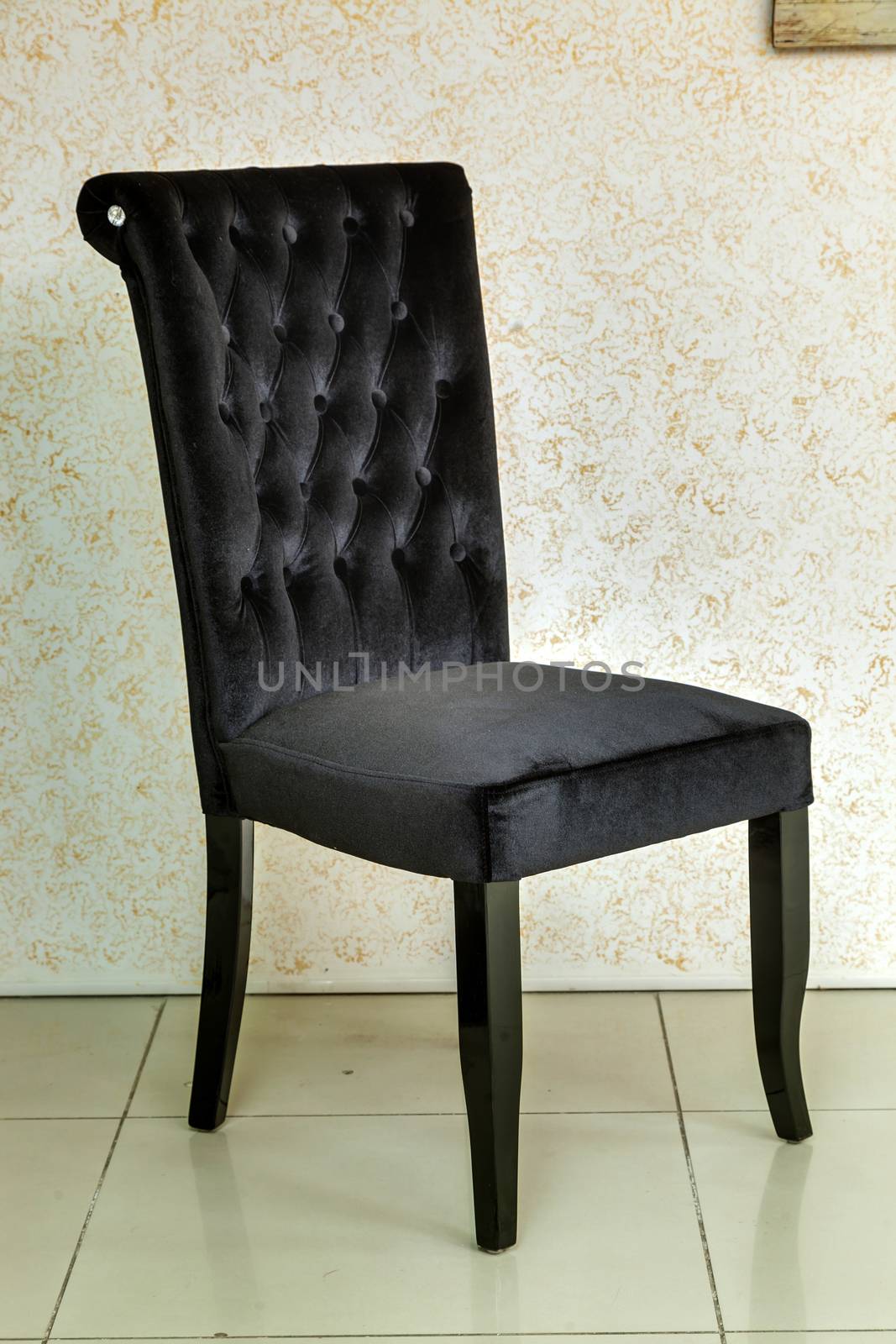 magnificent black chair an upholstery textile in the room