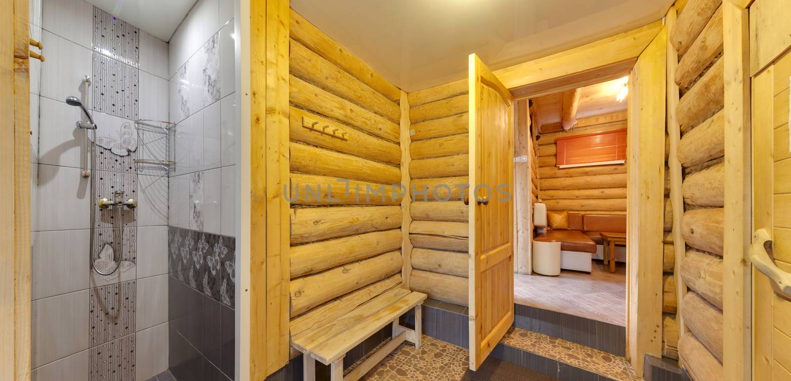 shower cabin with a watering can in a sauna