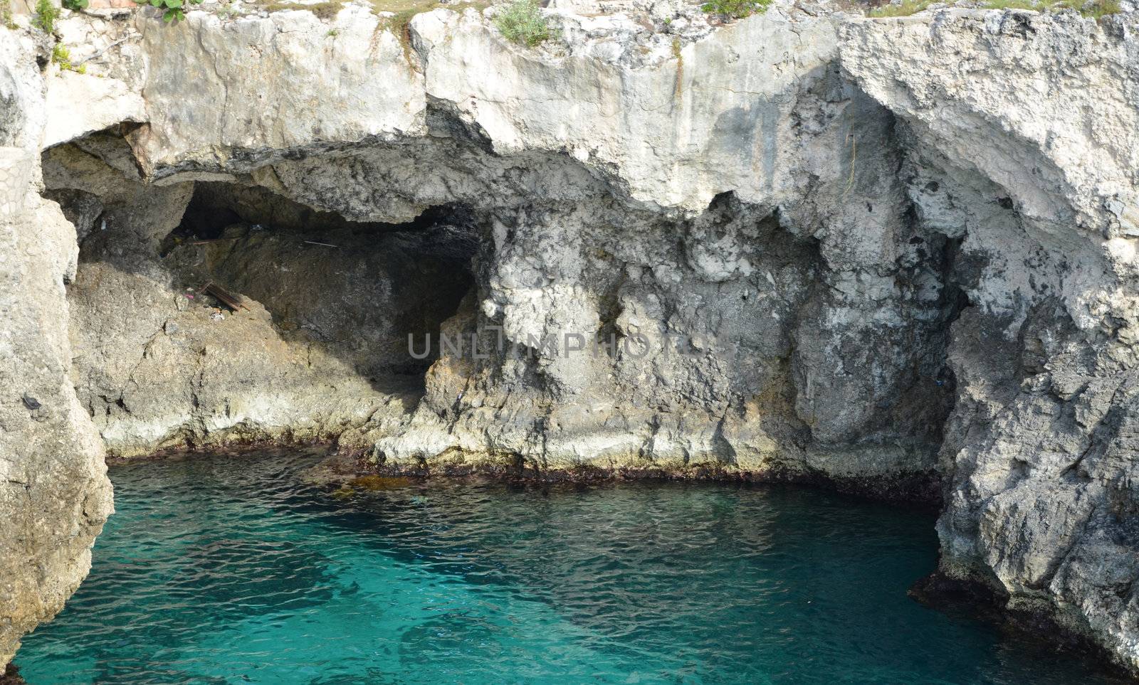 A deep pool with cliffs on three sides. On the coast of Jamaica