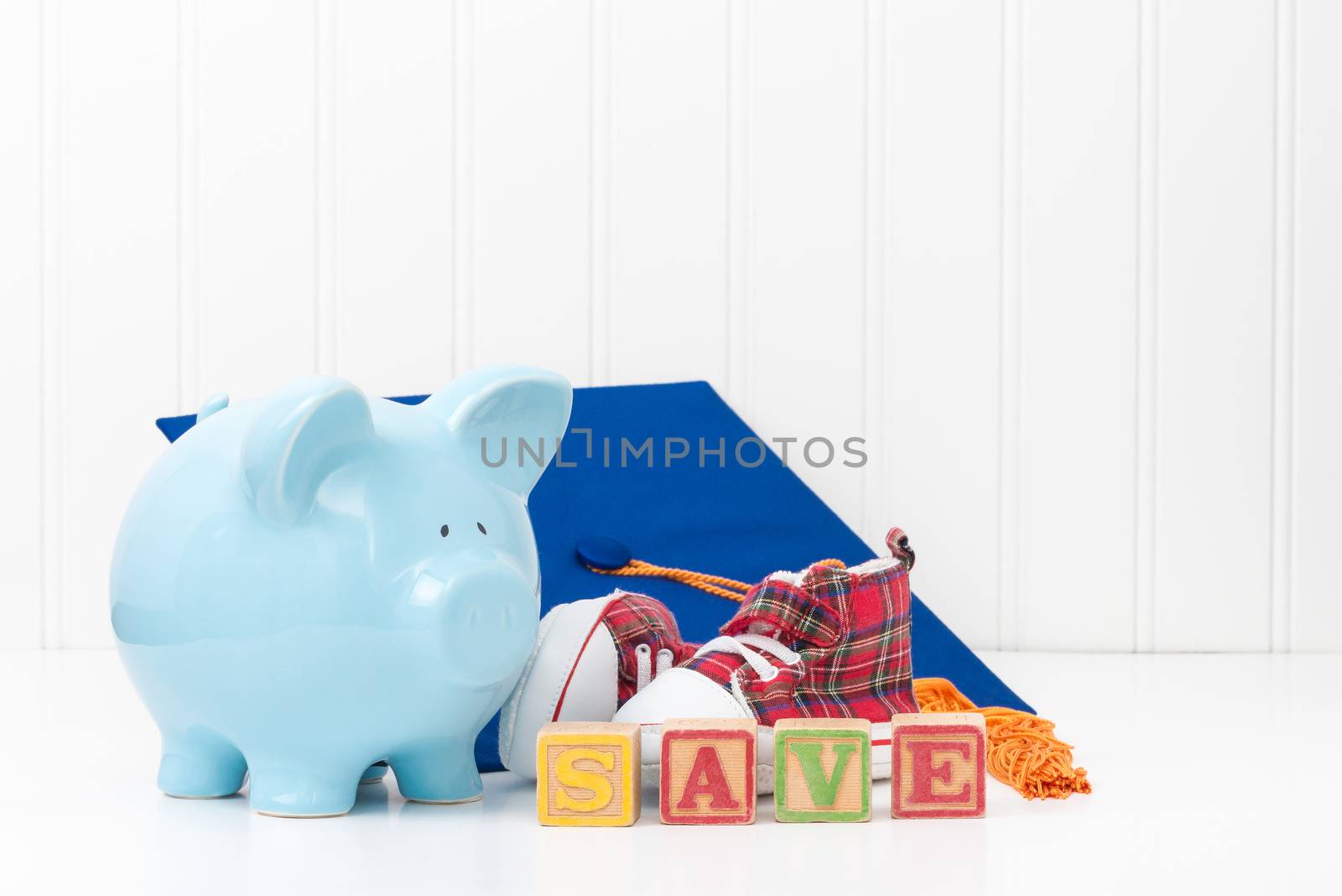 Piggy bank and infant shoes.  Conveys the concept that it is never too early to start saving.