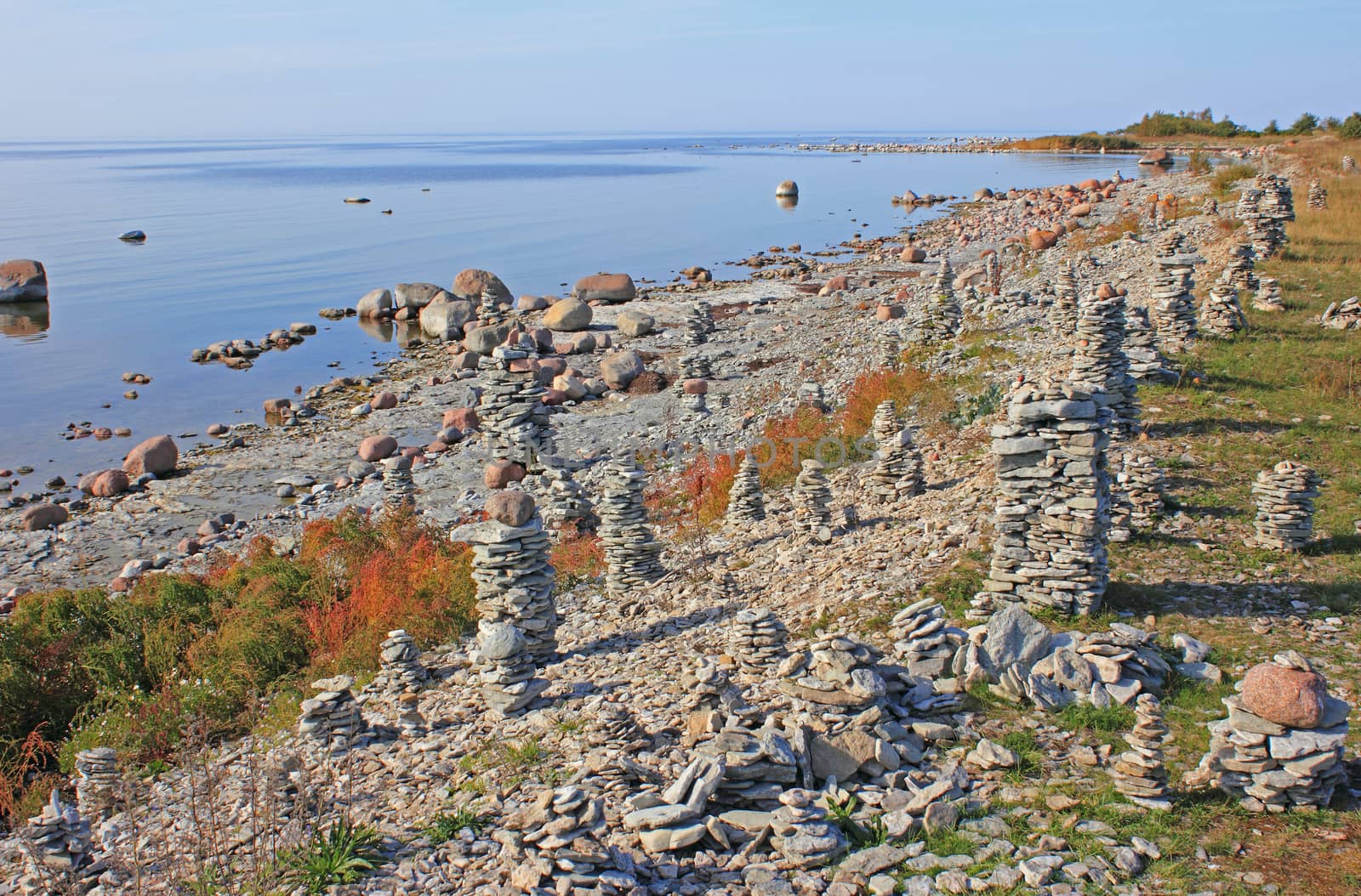 Human made stone structures on on pebble beach, Saaremaa island, Estonia. These structures have become one of the main sight in Saaremaa. Soft evening sunlight.