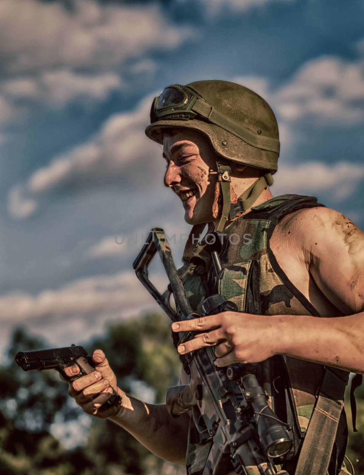 young a soldier in the uniform with weapon