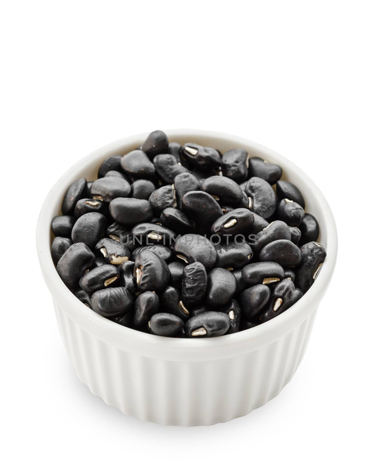 black bean seeds in white bowl. by Gamjai