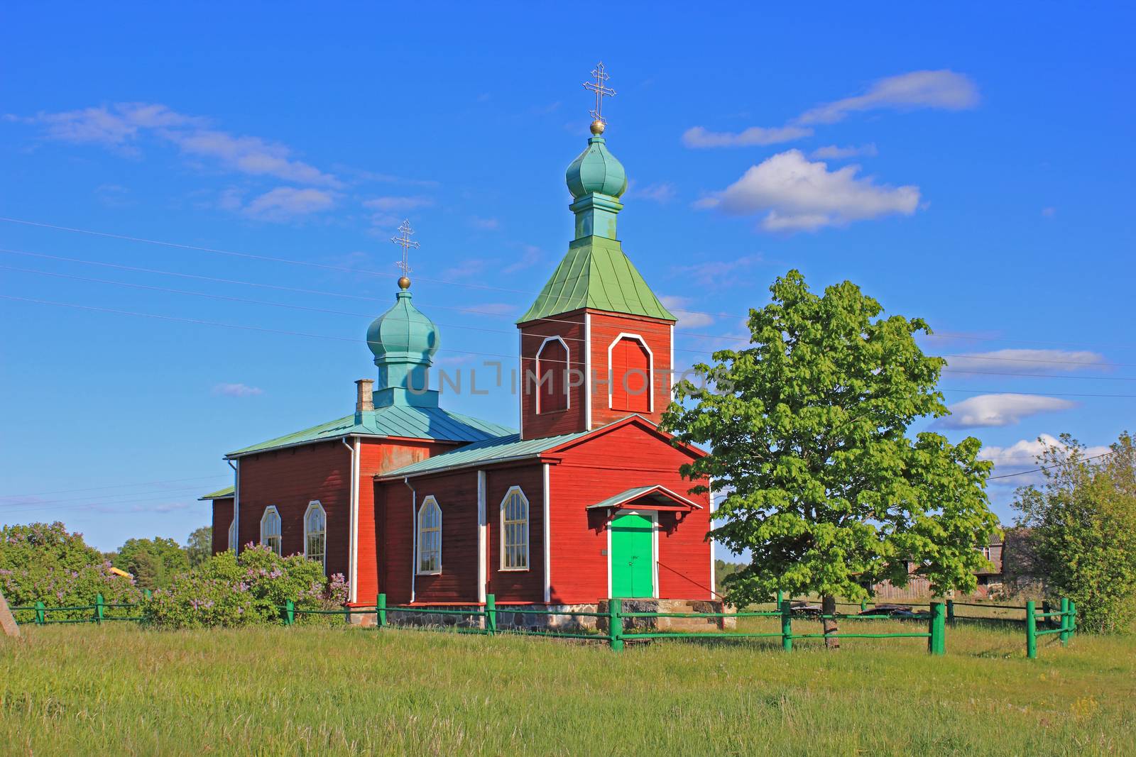 Orthodox  church in Metsküla village. Saaremaa island, Estonia.
Evening sunlight and blue, cloudy sky in background.