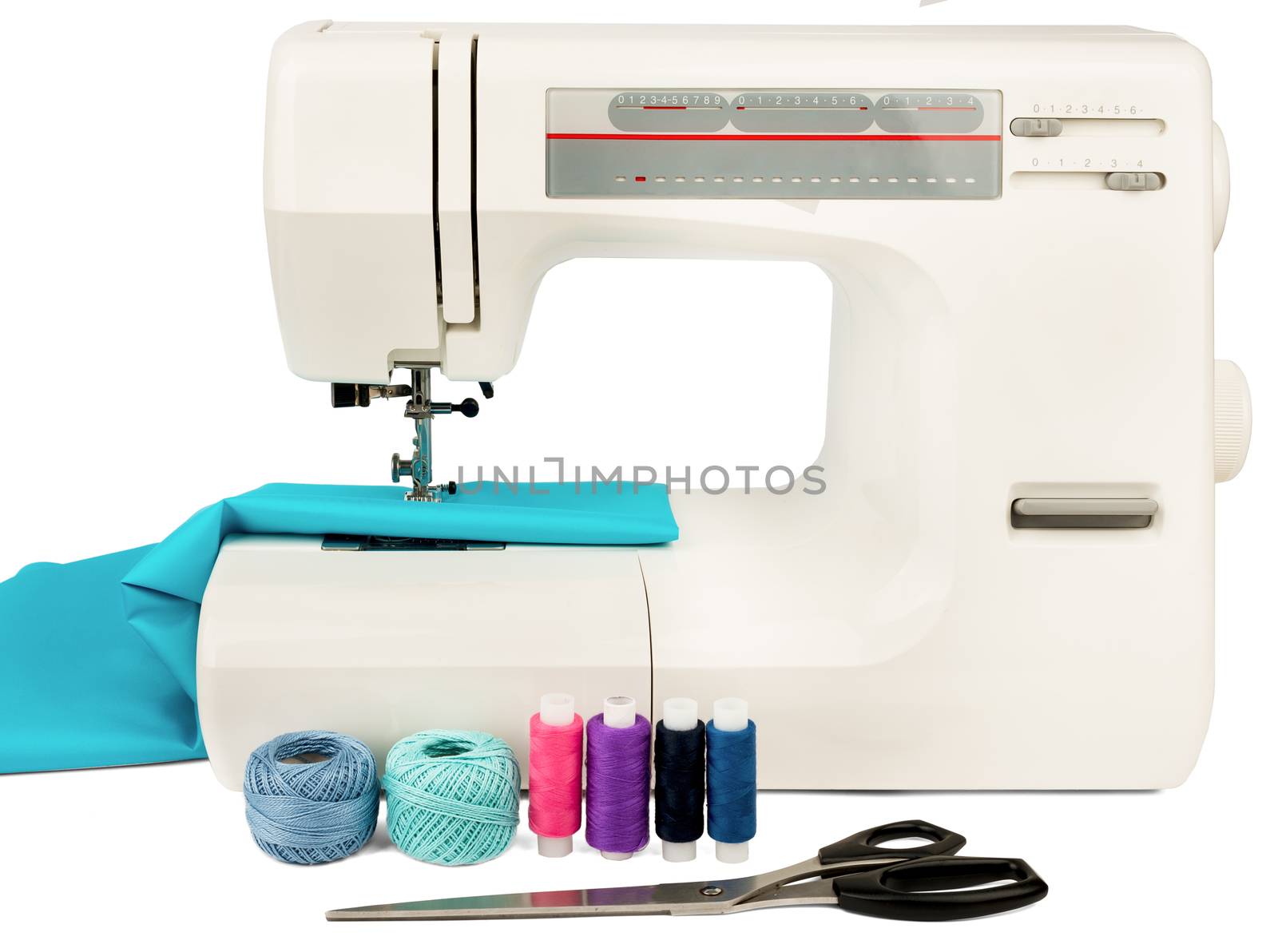 Sewing machine with fabric, threads and scissors isolated on white background