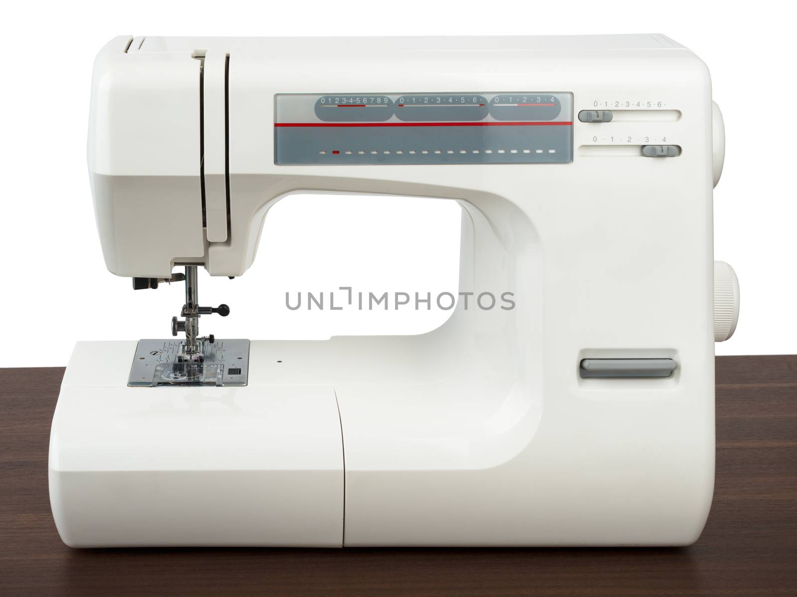 Sewing machine on table isolated on white background