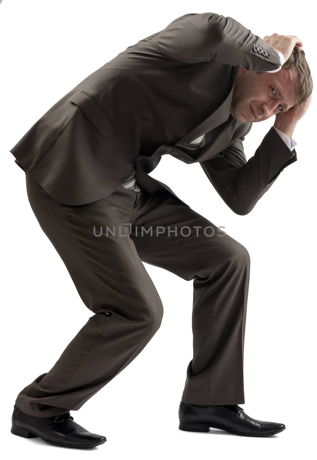 Portrait of frustrated young man holding his head isolated on white backgroud
