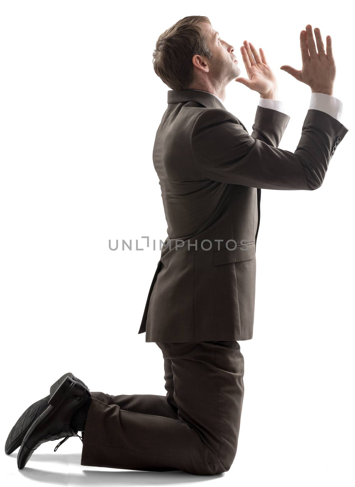 Isolated business man pray position by cherezoff