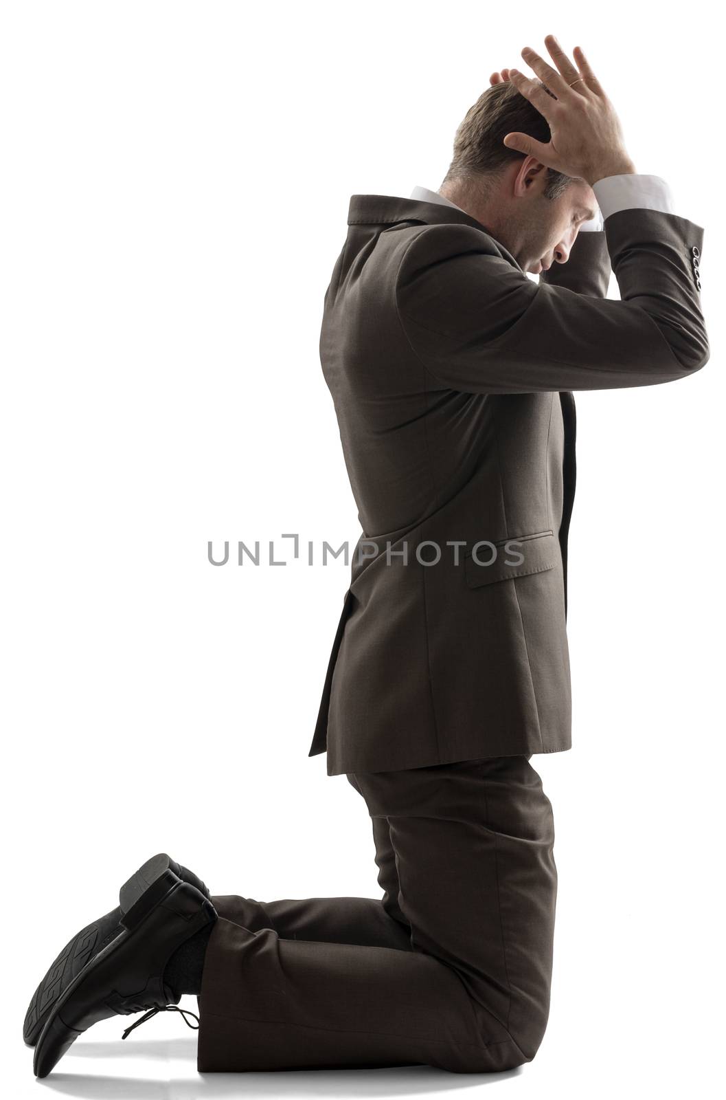 Isolated business man pray position on white background