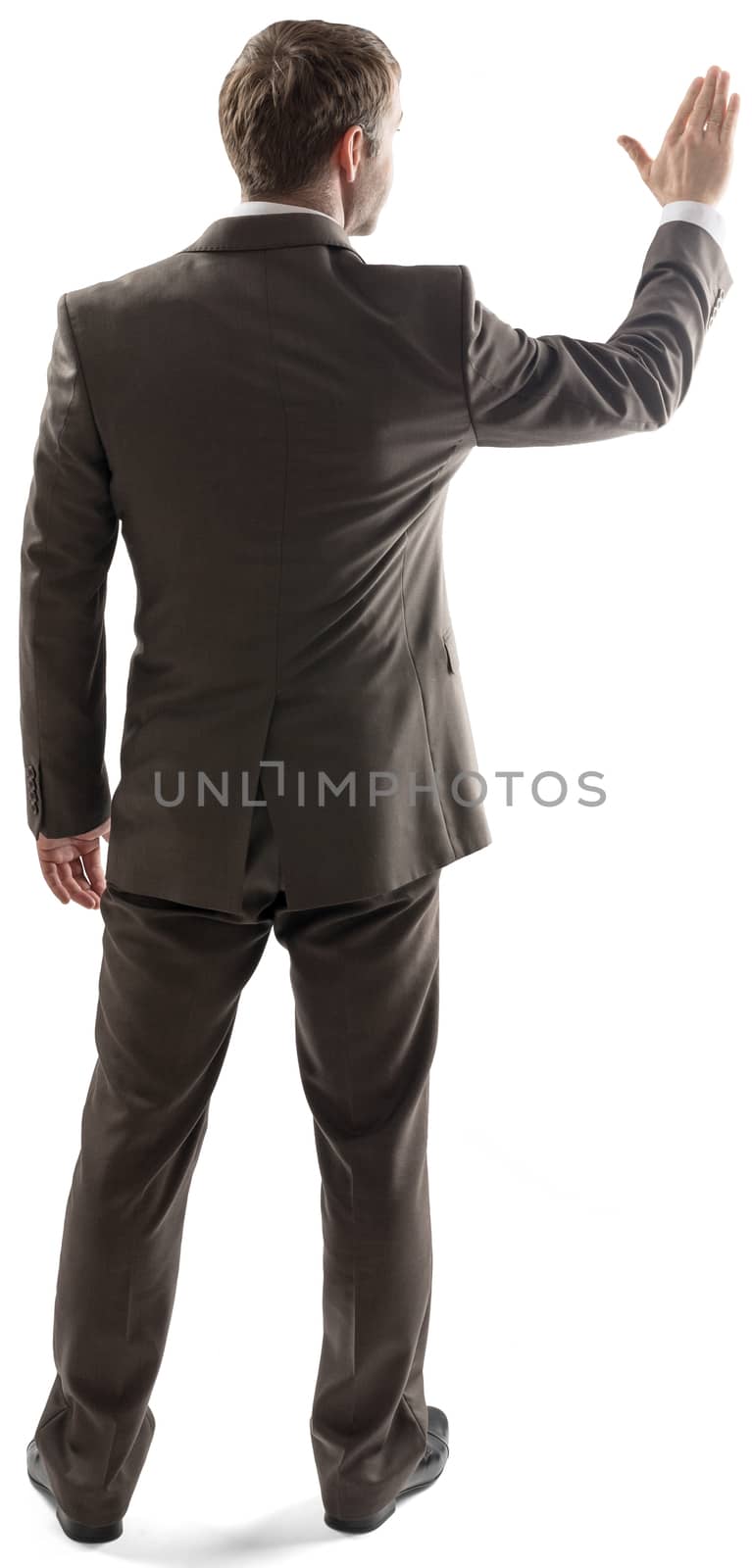 Rear view of businessman touching at copy space  by cherezoff