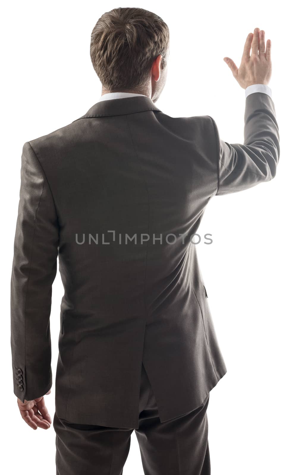 Rear view of businessman touching at copy space  by cherezoff