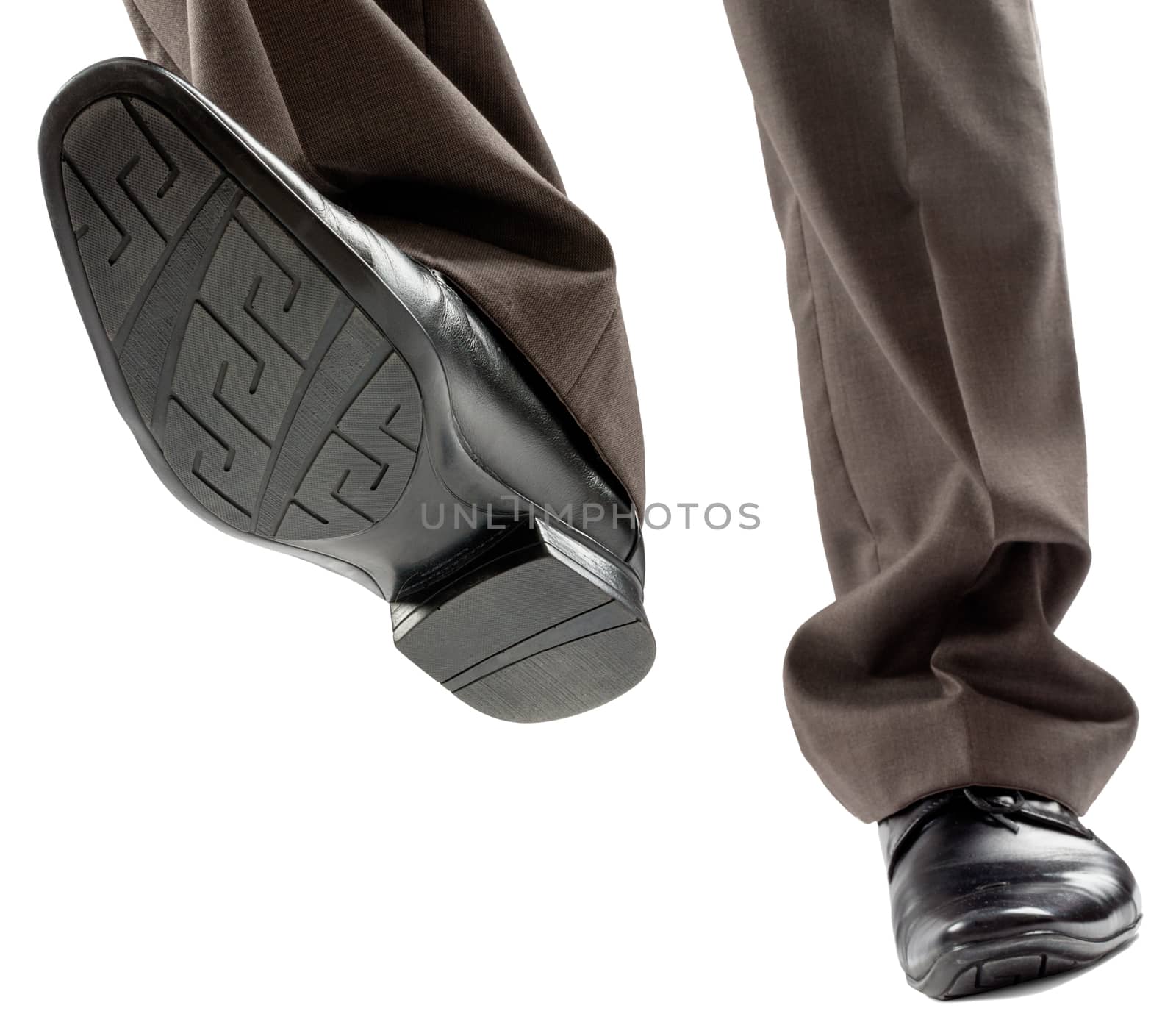 Feet of man in black shoes isolated on white background