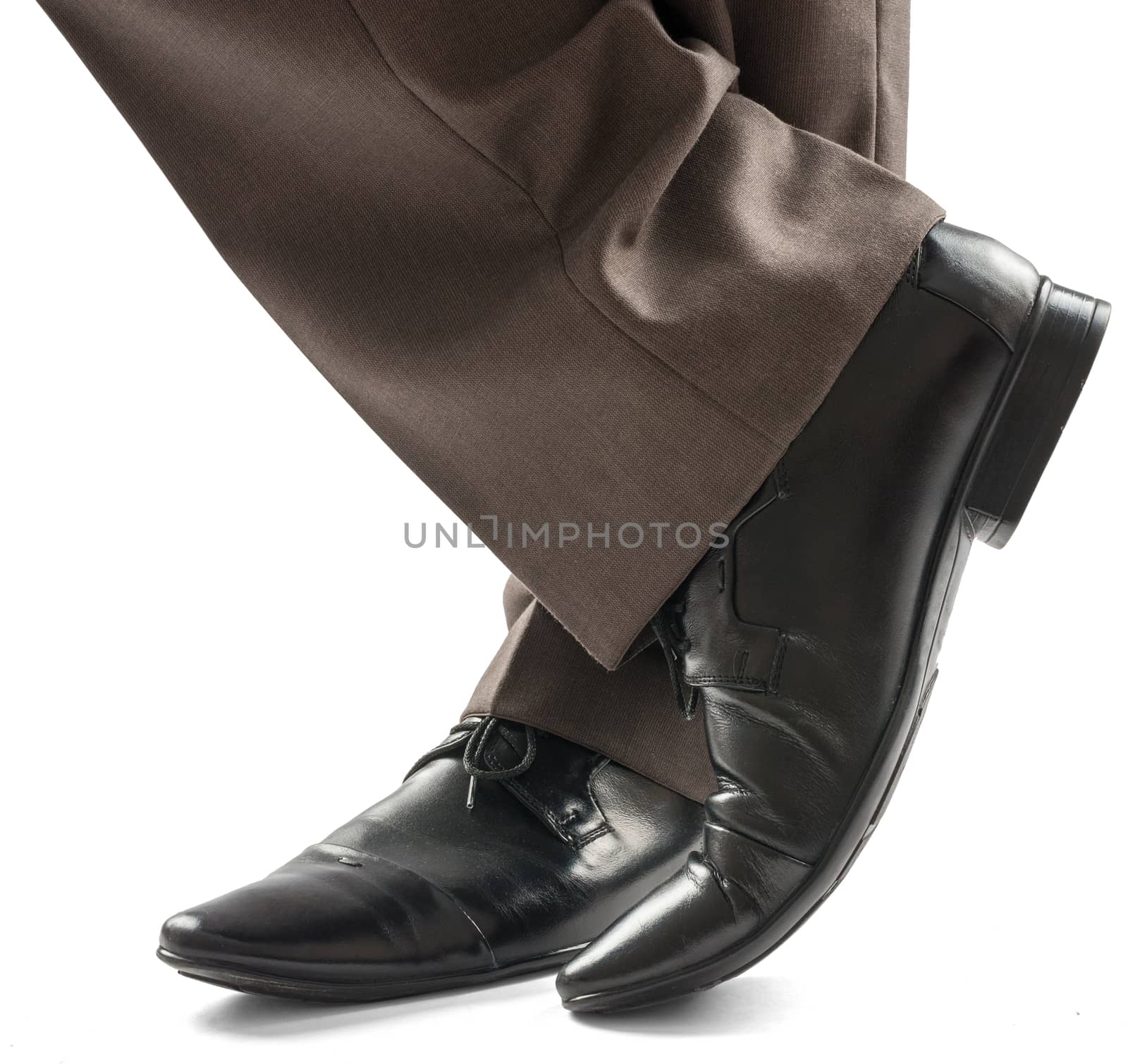 Businessman standing on floor, closeup of feet