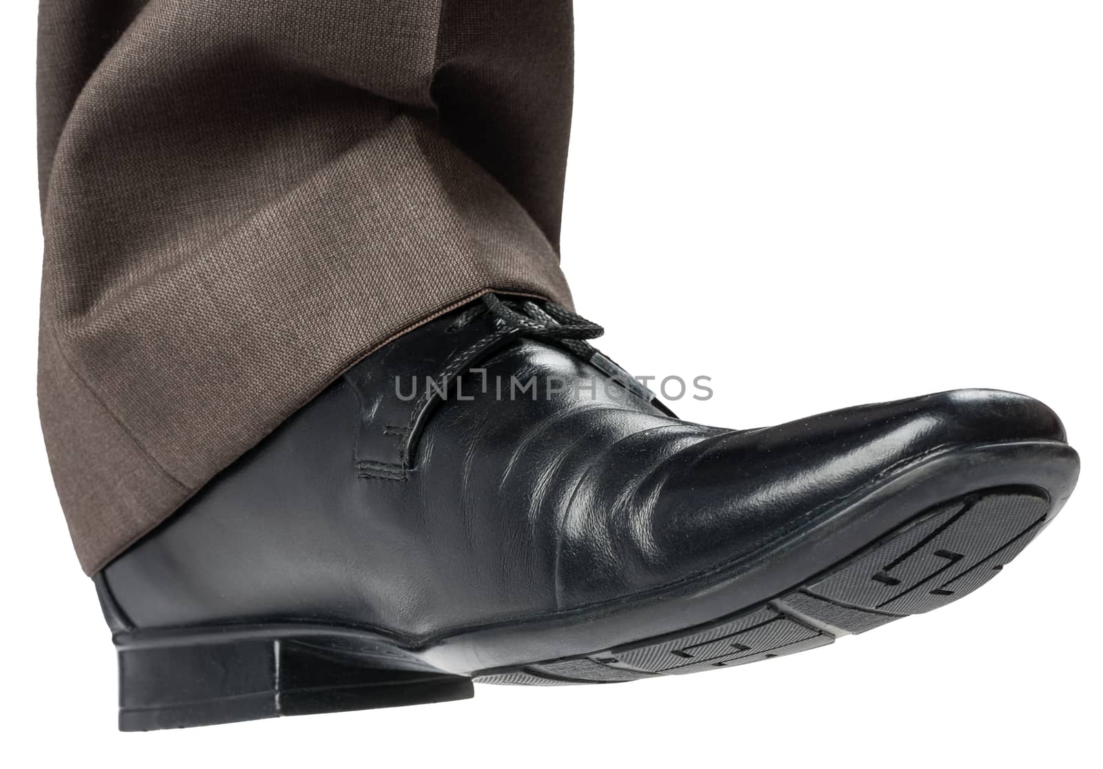 Feet of man in black shoes by cherezoff