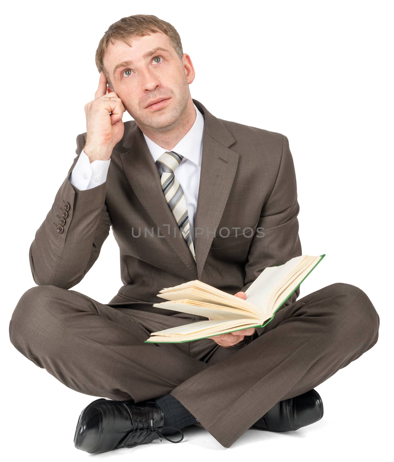 Man sitting with book and thinking isolated on white background