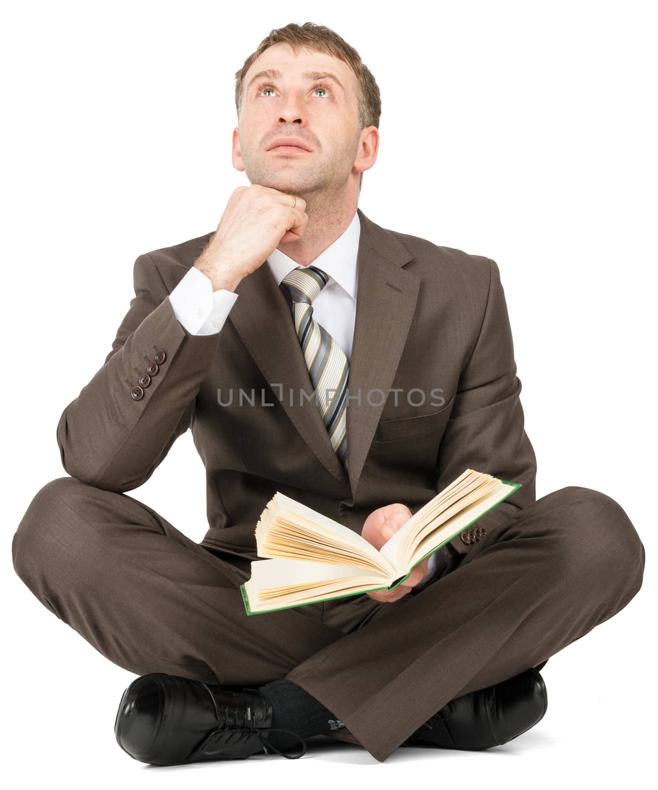 Man sitting with book and thinking by cherezoff