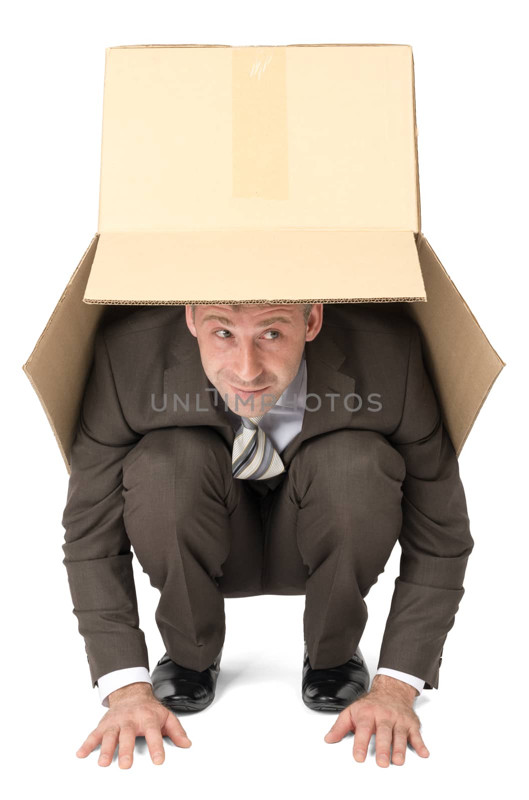 Businessman hiding under box by cherezoff
