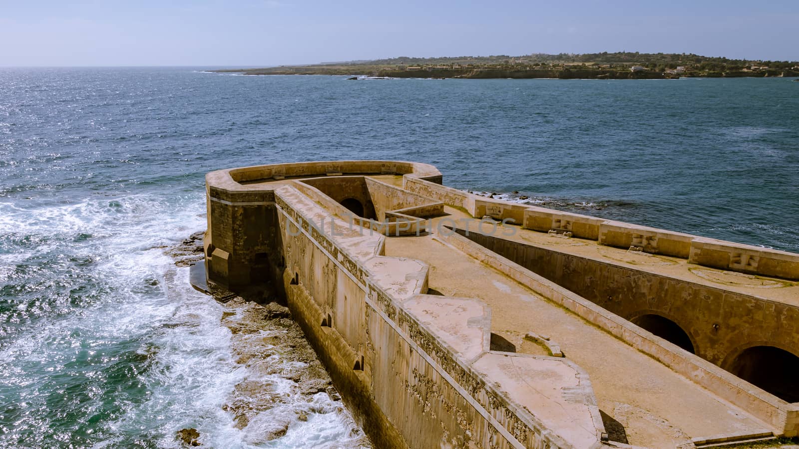 Scenic view of Maniace castle on sea, Syracuse, Sicily, Italy