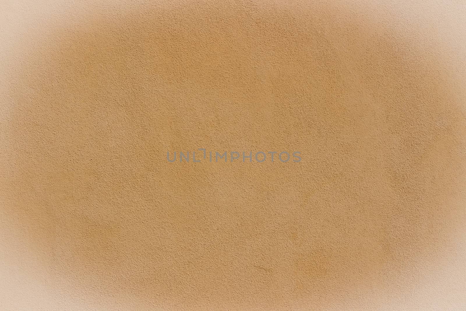 Orange wall background and texture with white vignetting and blank copyspace for text or advertising.