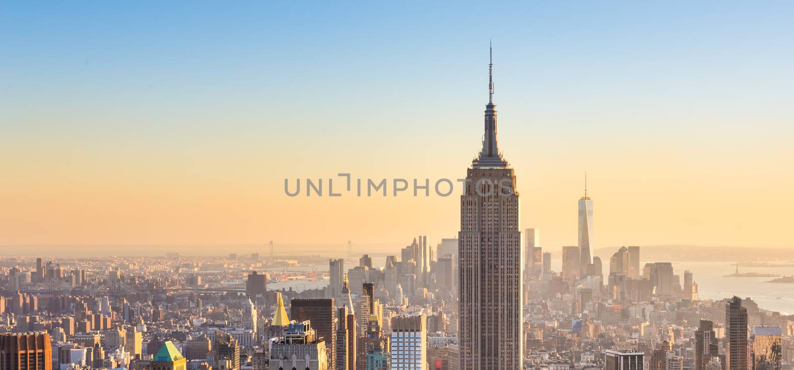 New York City Manhattan skyline in sunset. by kasto
