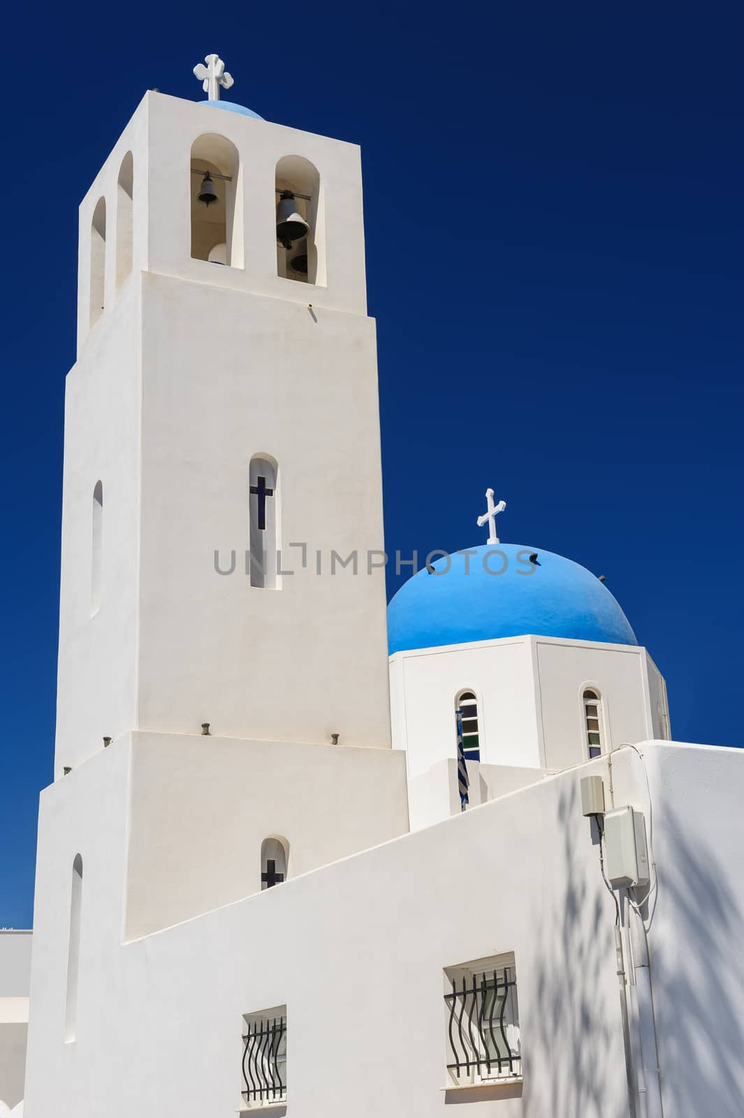 Blue and white orthodox church bell tower. Oia, Santorini Greece. Copyspace