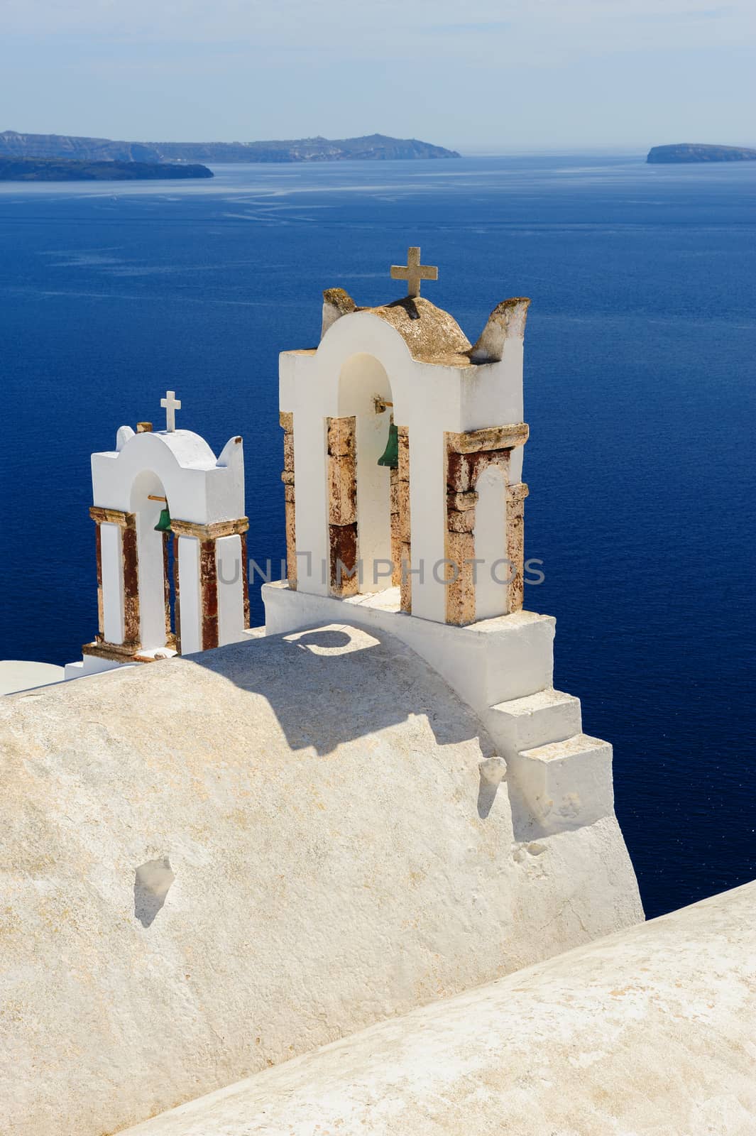 Blue and white orthodox church bell tower. Oia, Santorini Greece. Copyspace