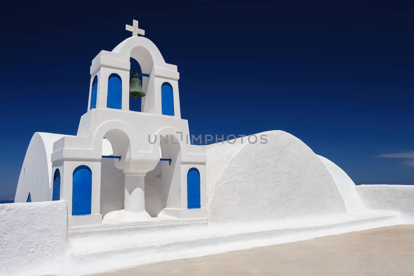 Blue and white orthodox church bell tower. Oia, Santorini Greece. Copyspace