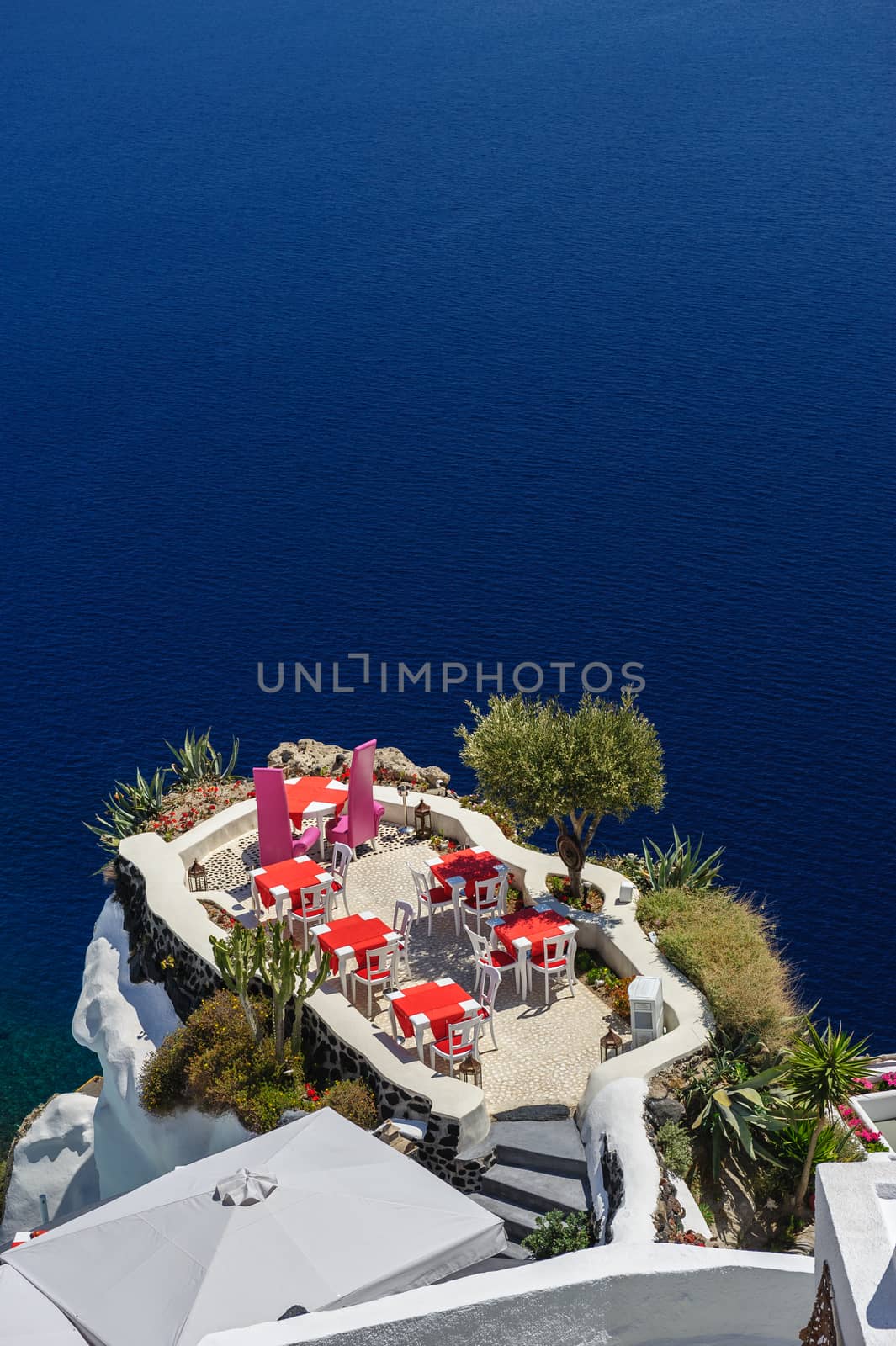 Luxury outdoor sea view cafe of Oia, Santorini, Greece. Lot of copyspace.