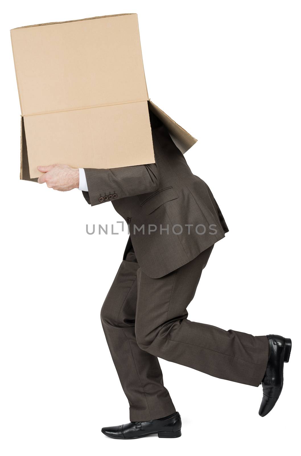 Businessman running with brown box on his head by cherezoff