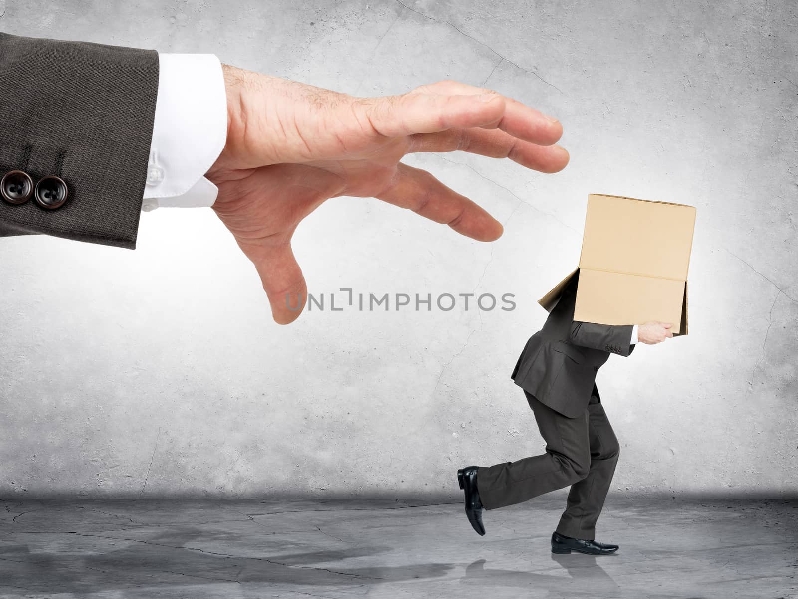 Business boss hand catching employee with box by cherezoff