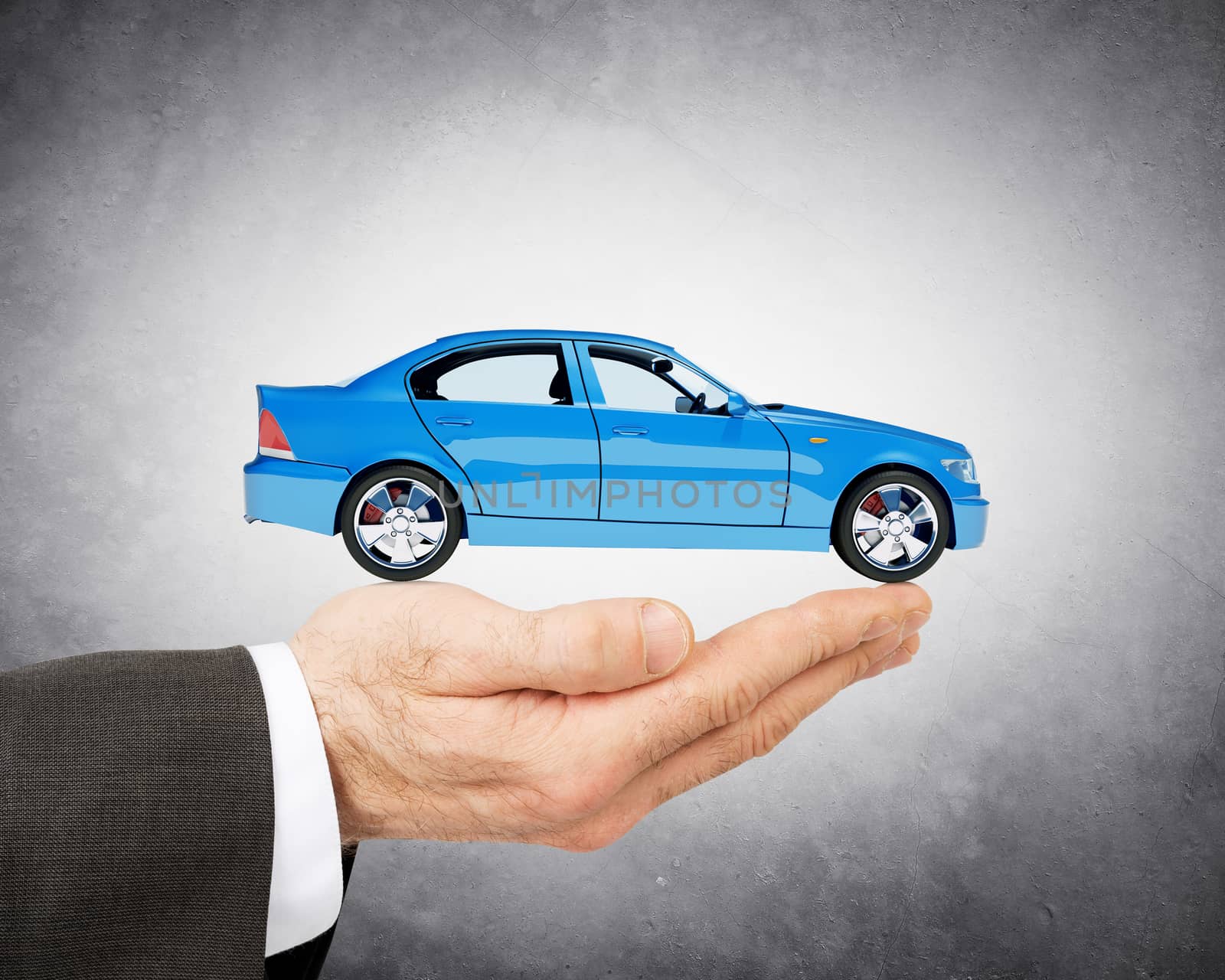 Hand of businessman with lovely blue car by cherezoff