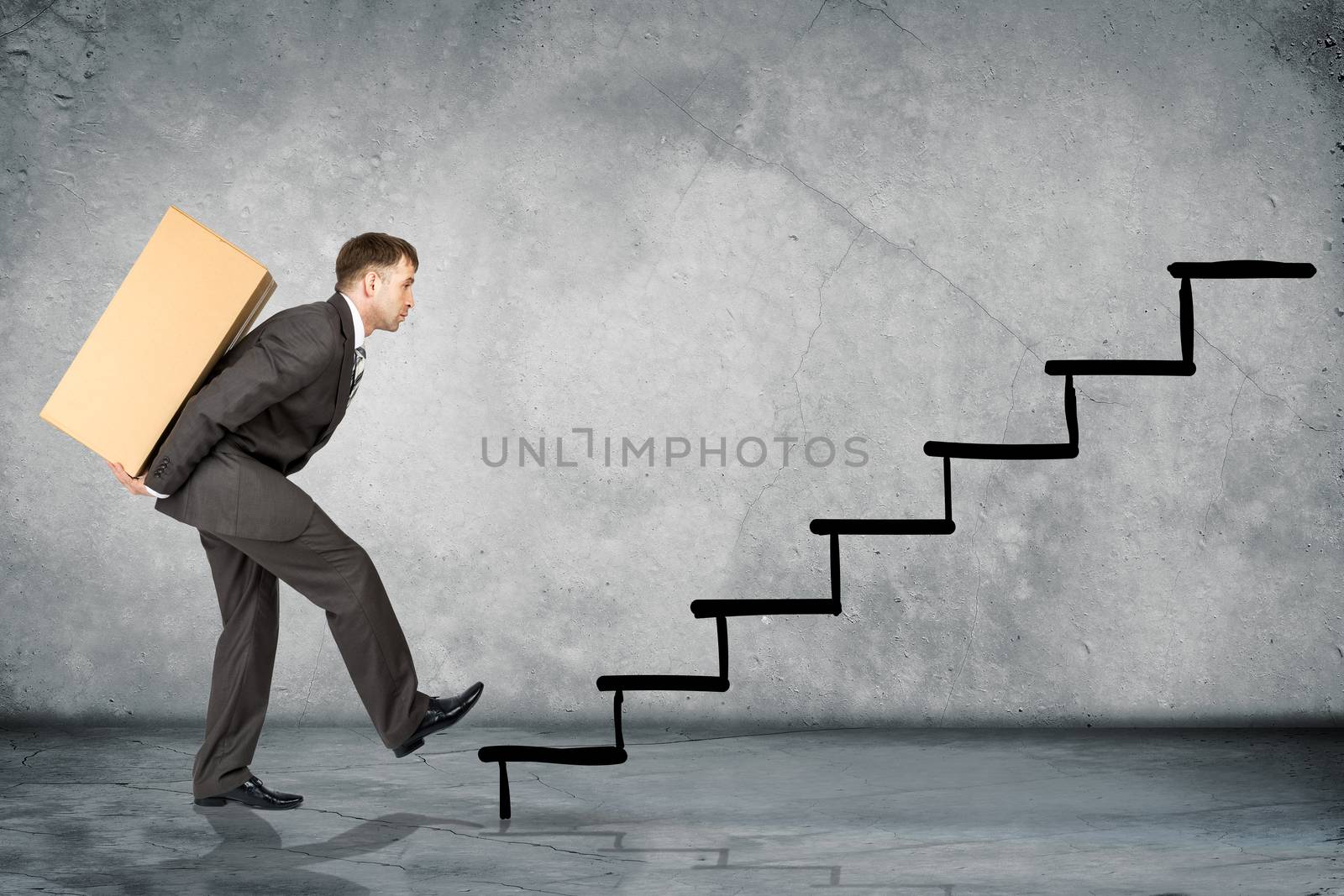 Middle aged business man with difficult task going up stairs