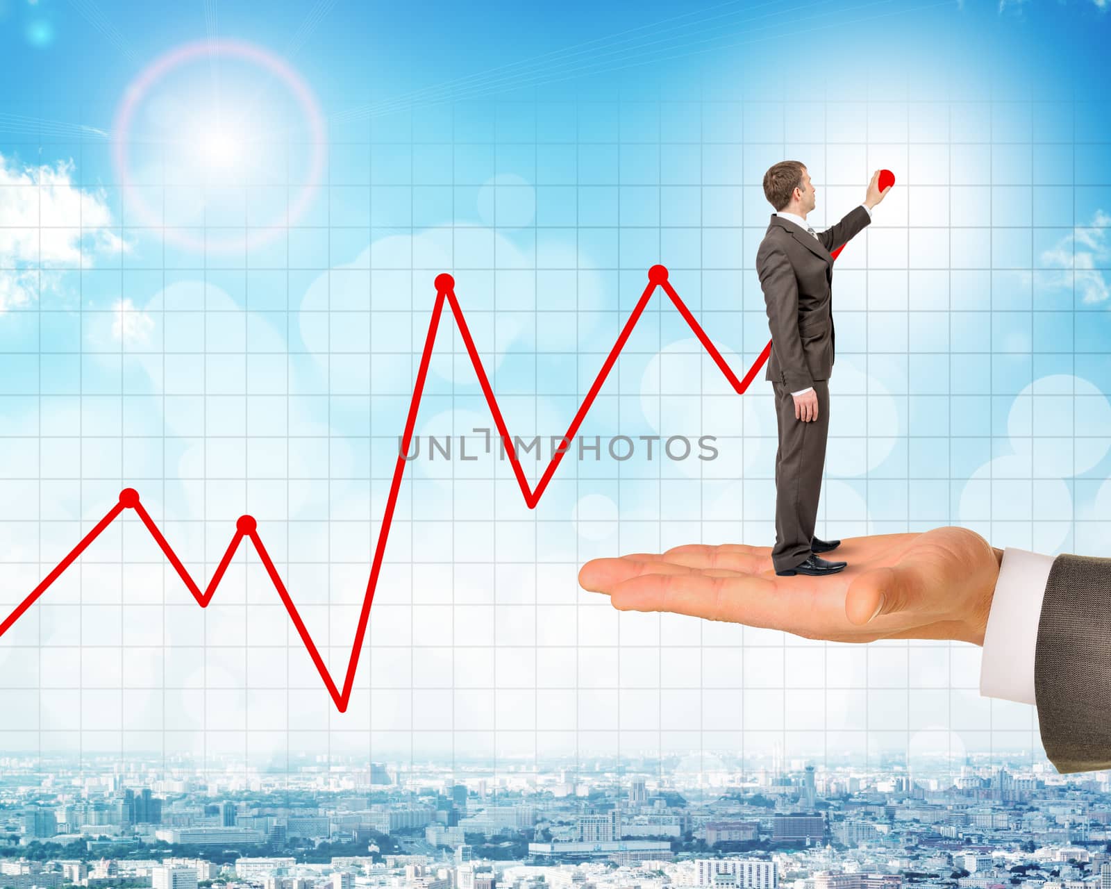 Man holds businessman drawing growth chart over city background