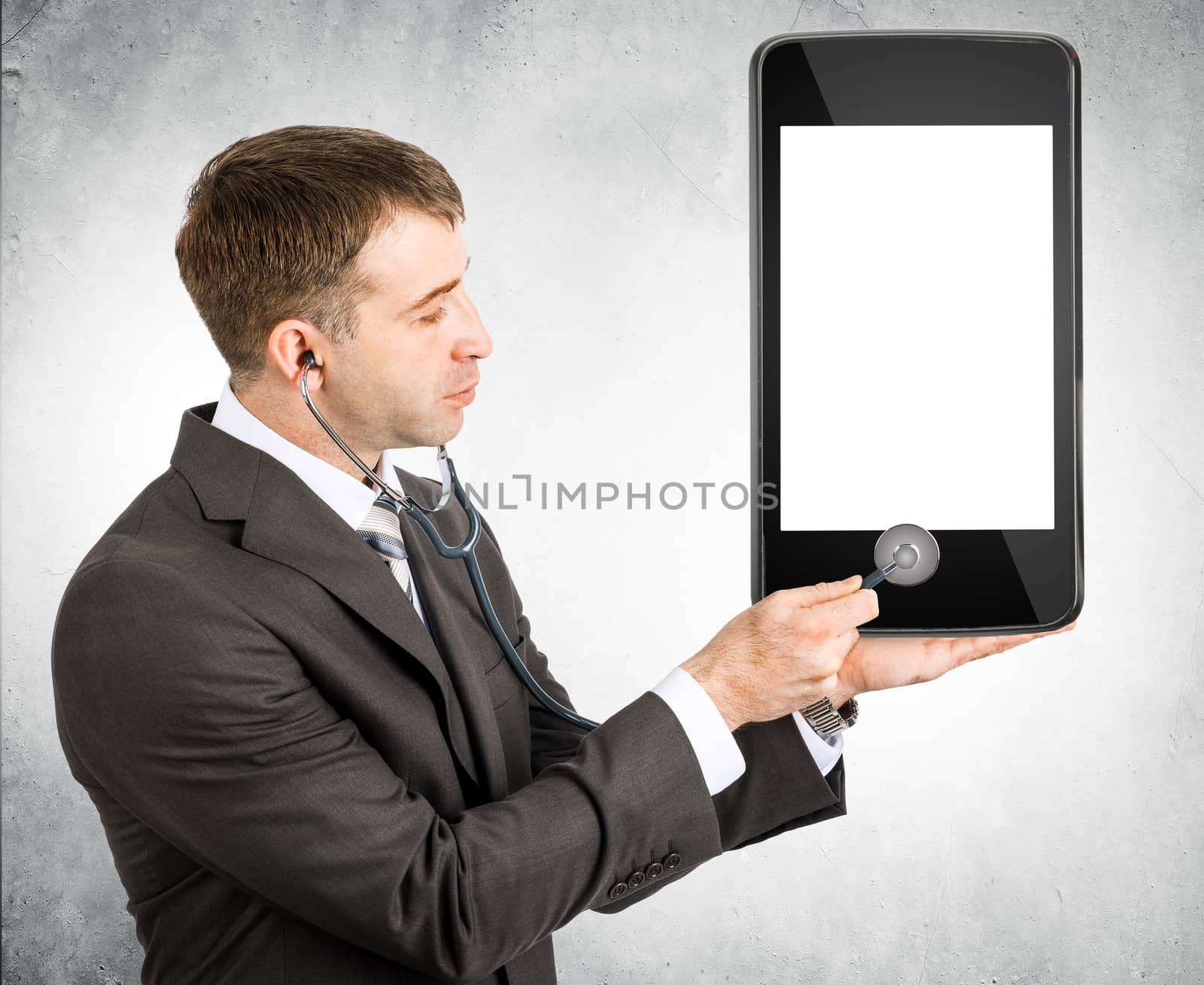 Businessman listening to smartphone within stethoscope, cure concept