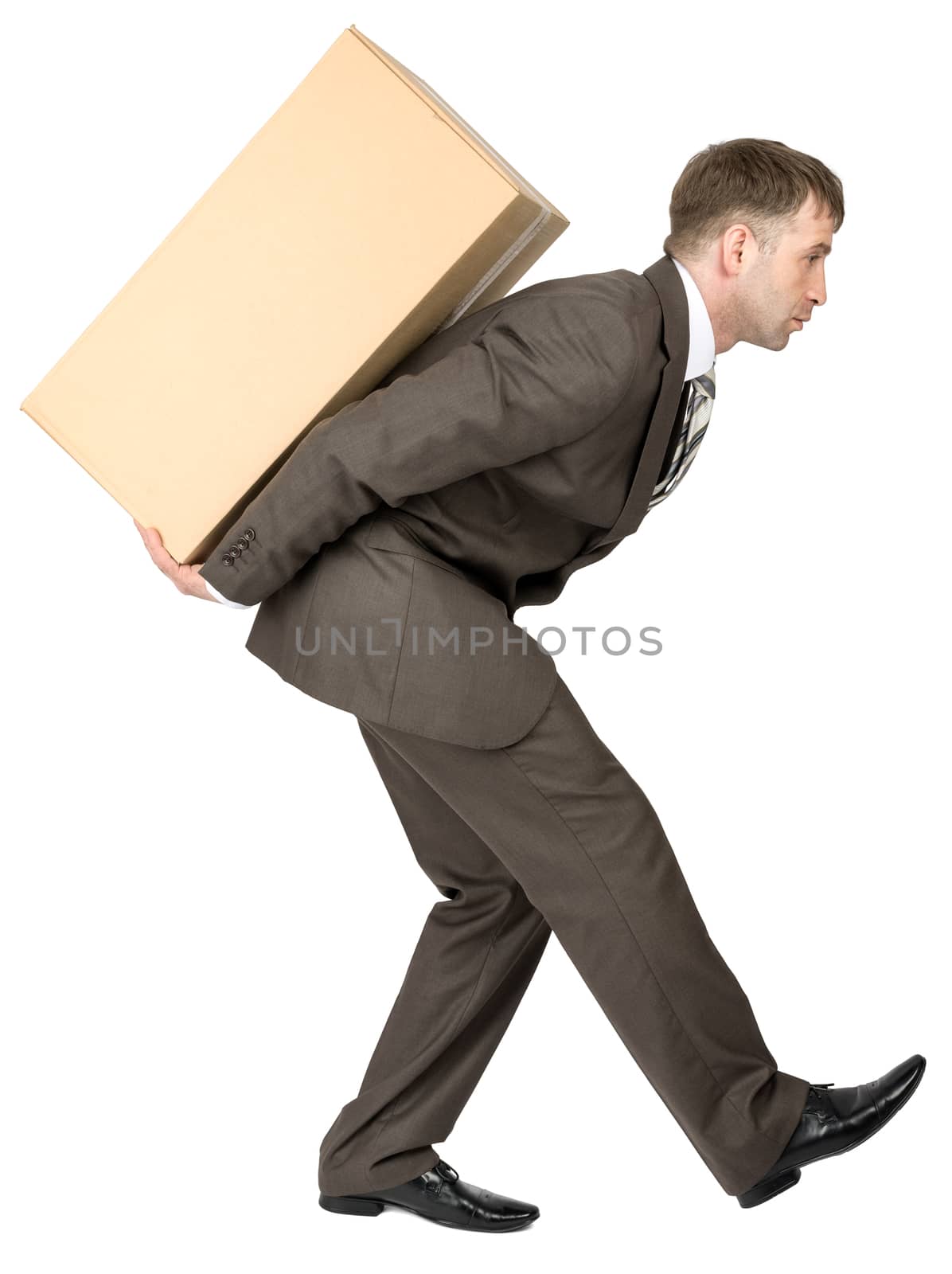 Businessman holding packages on back, looks forward. Isolated on white background