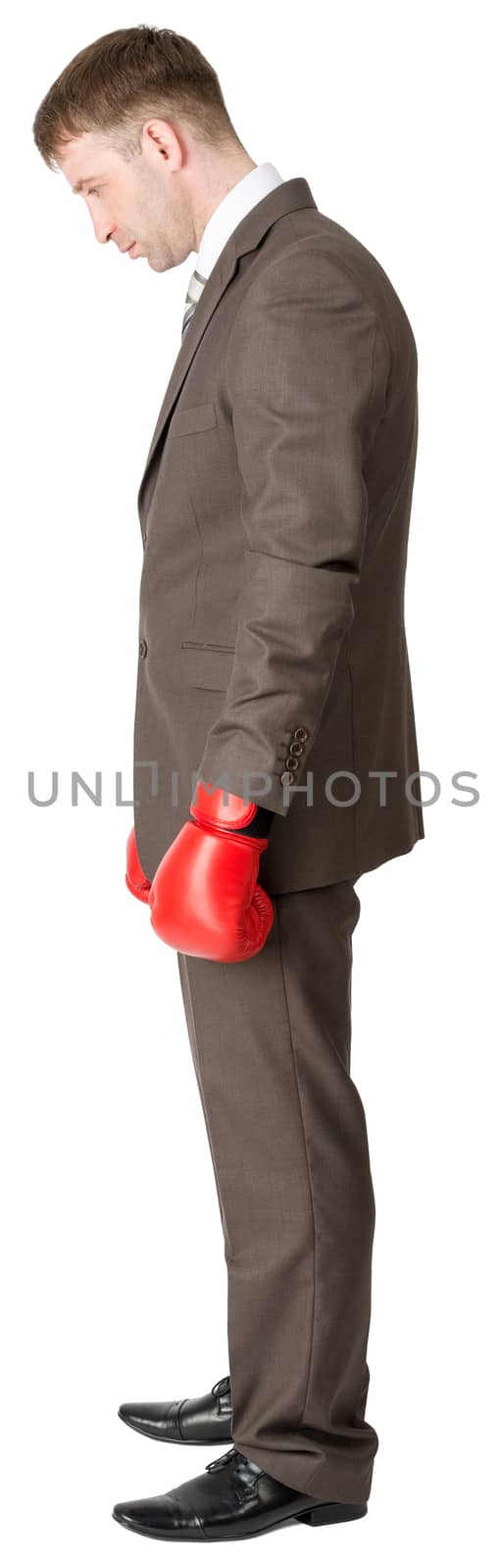 Sad businessman in boxing gloves isolated on white background