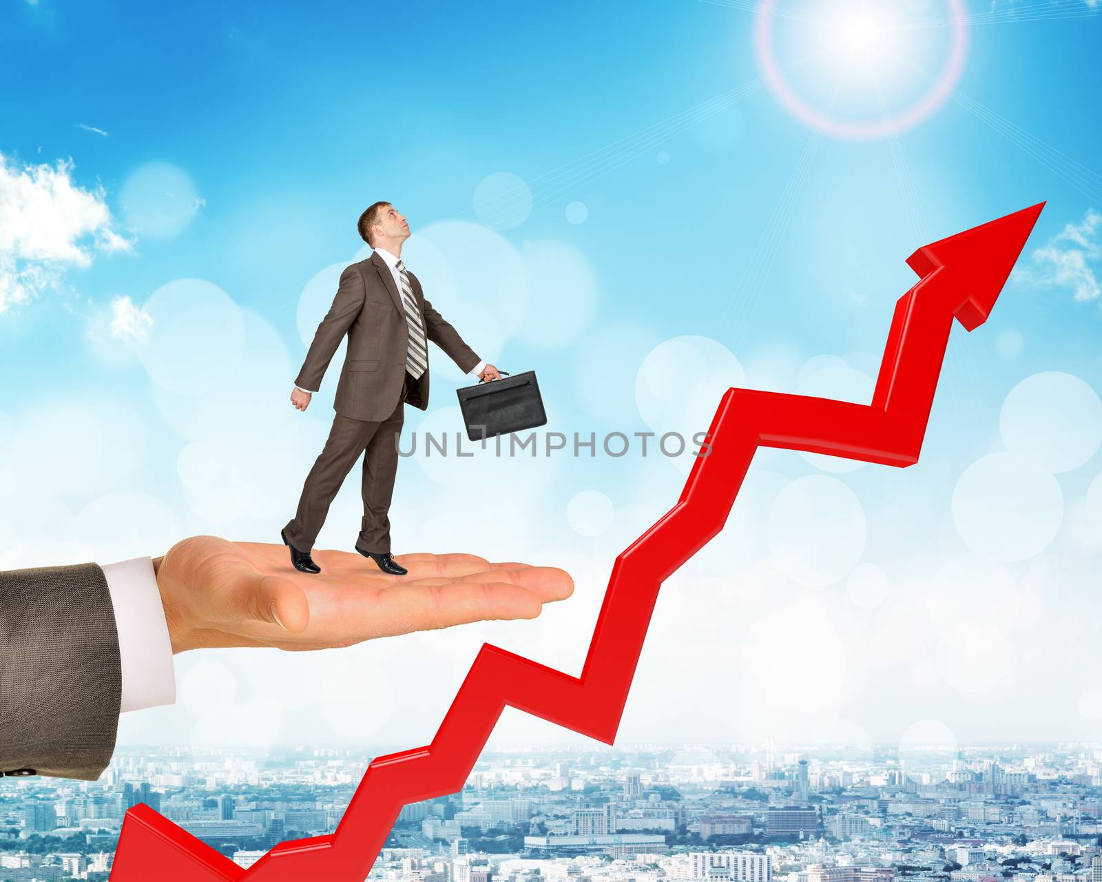 Man holds businessman with growth chart  over city background
