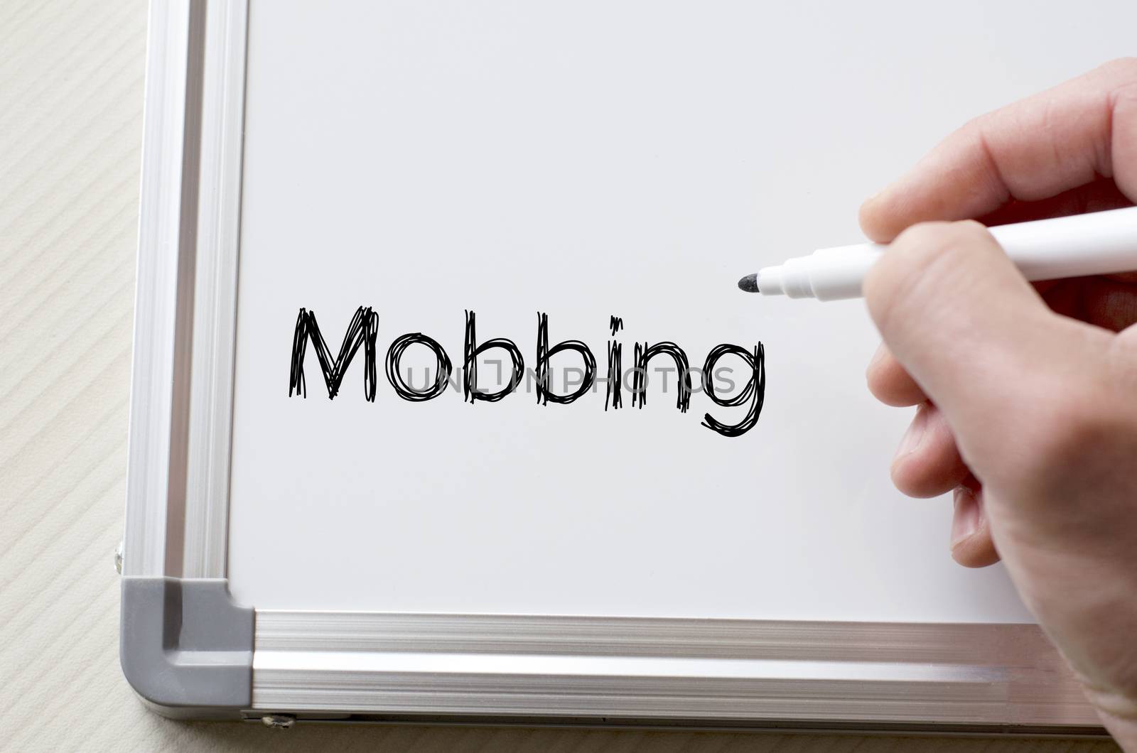 Mobbing written on whiteboard by eenevski