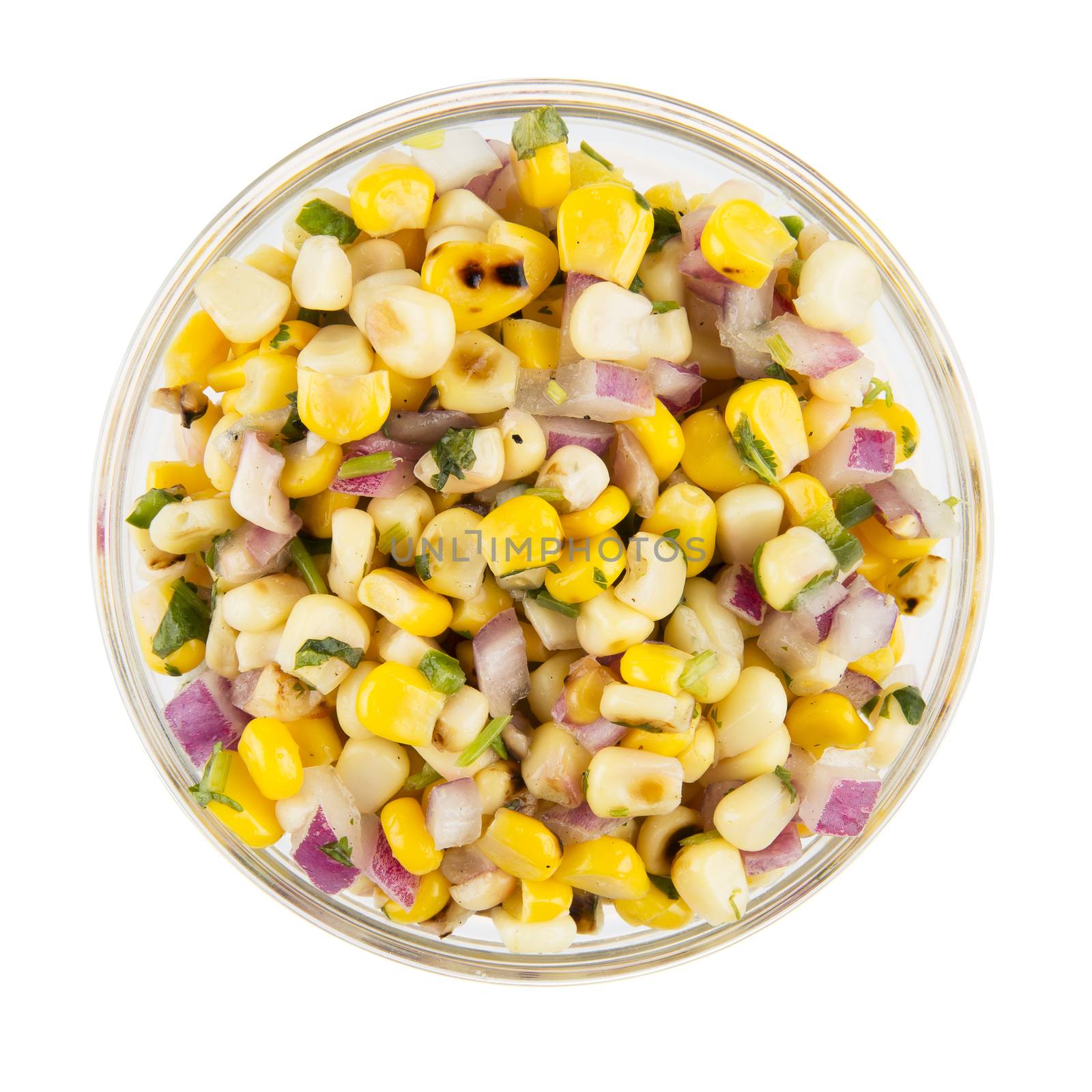 Bowl of grilled corn and onion mix isolated on white and viewed from above.