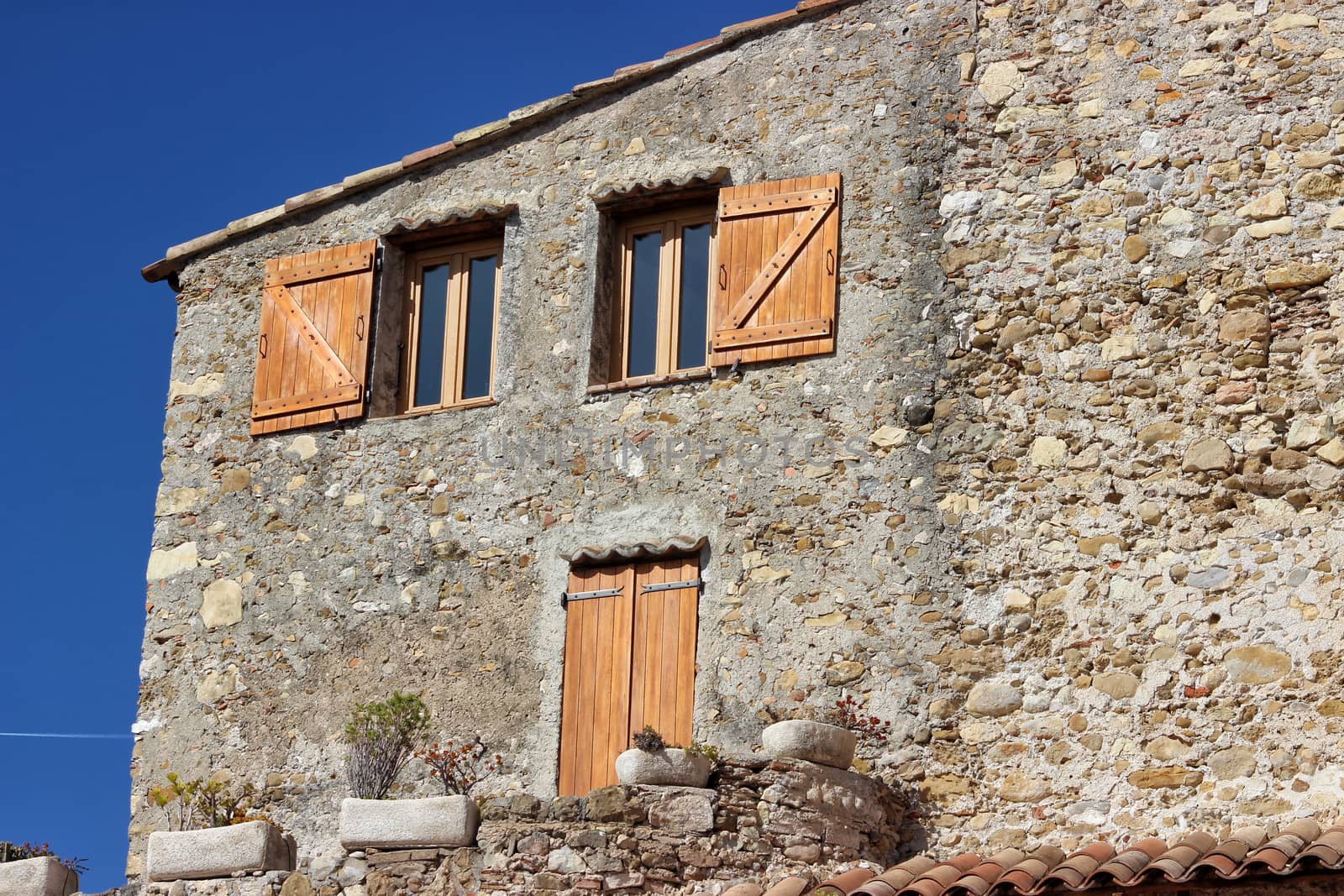 Facade of French House with Door and Windows in Roquebrune-Cap-Martin, France