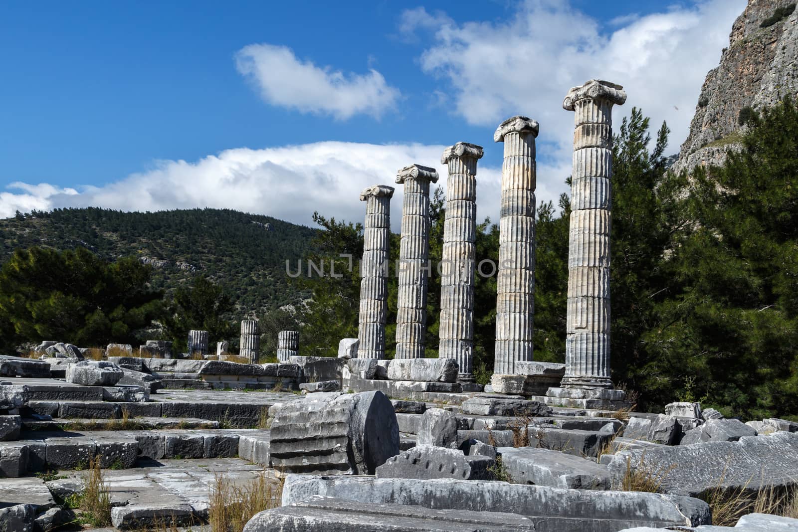 General temple view of Priene Ancient City in Aydın, Turkey, on bright blue sky background.
