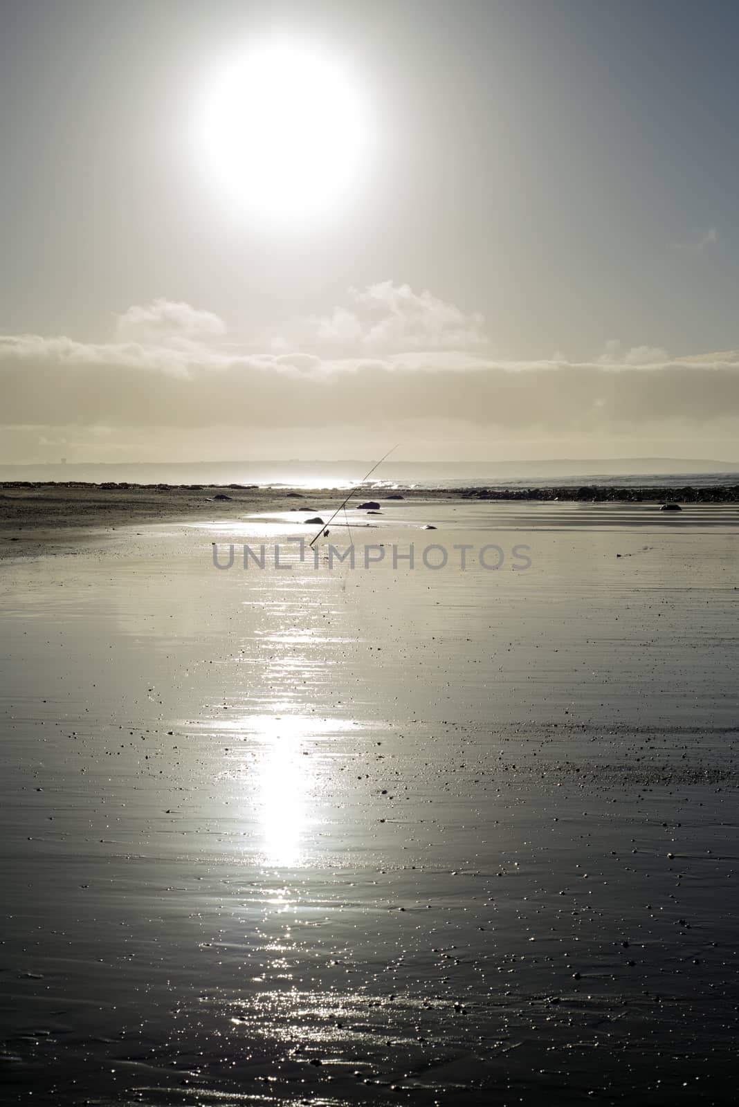 mounted fishing rod on a sunset beach in county Kerry Ireland