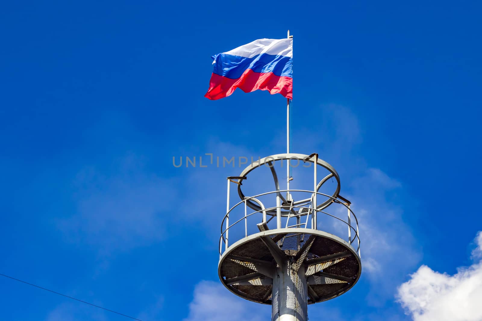 The flag of Russia on the observation deck of the column for technical purposes
