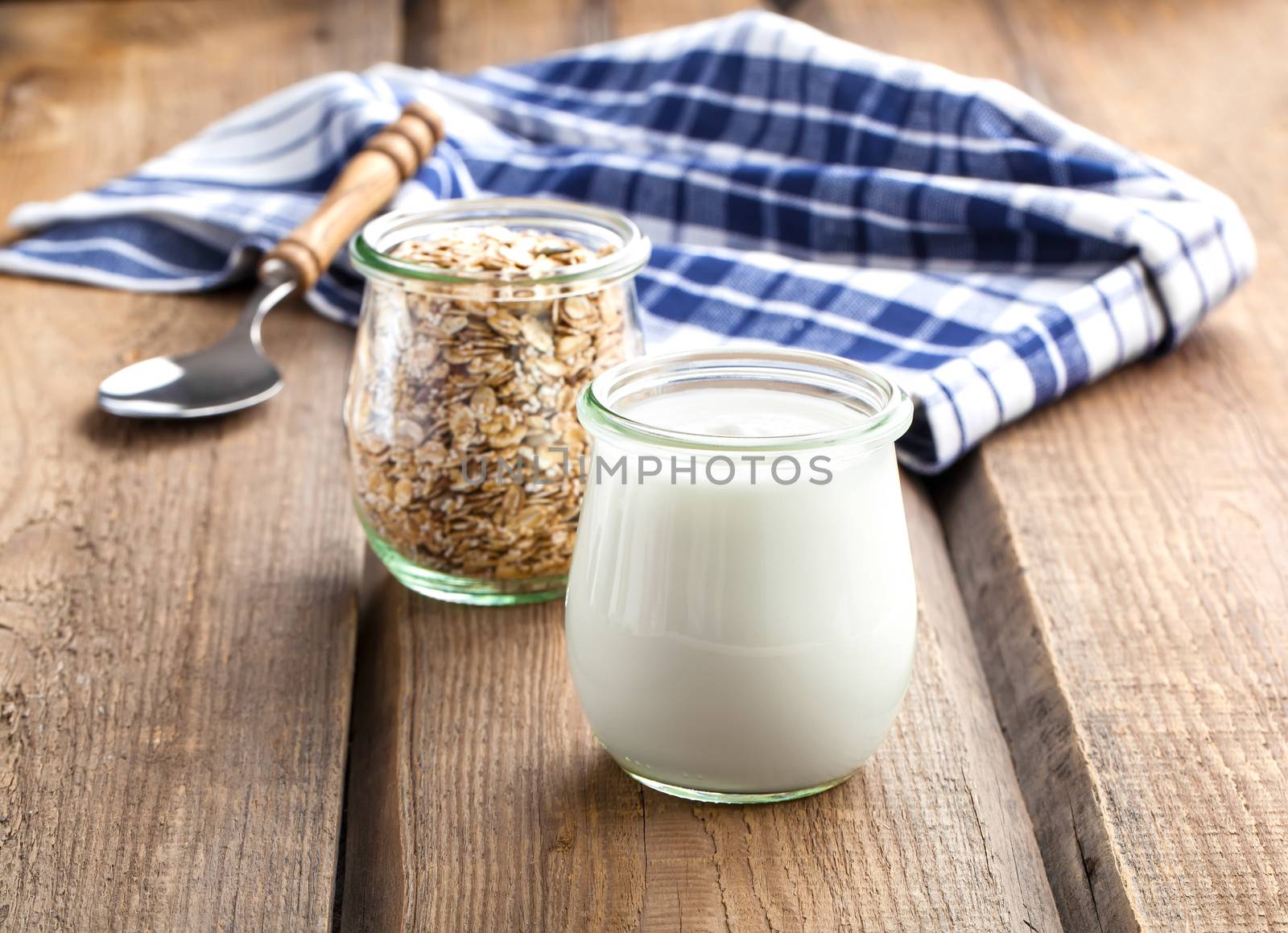 Delicious, nutritious and healthy yogurt in a glass jars with sp by motorolka