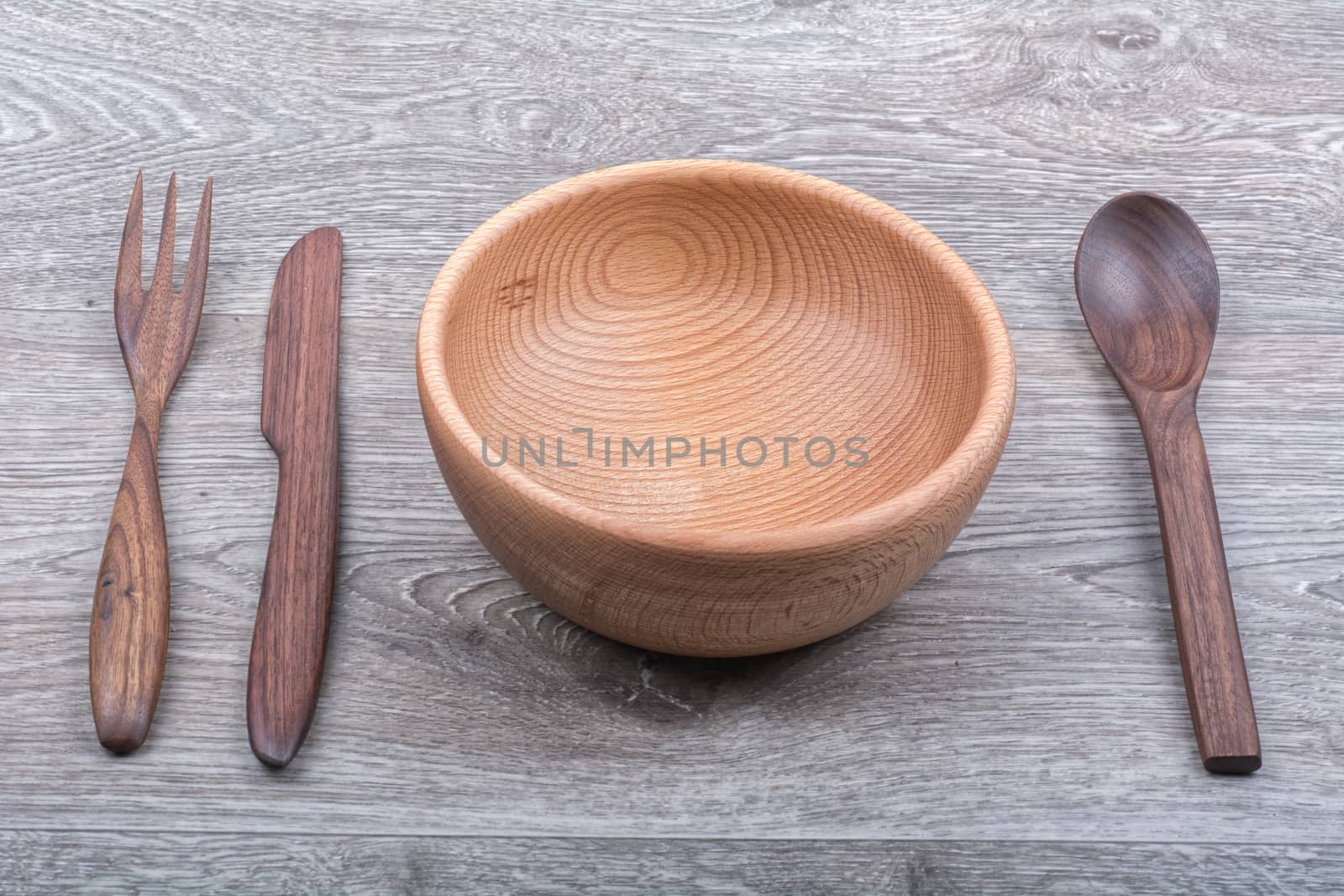 Wooden cutlery on a grey wooden background background
