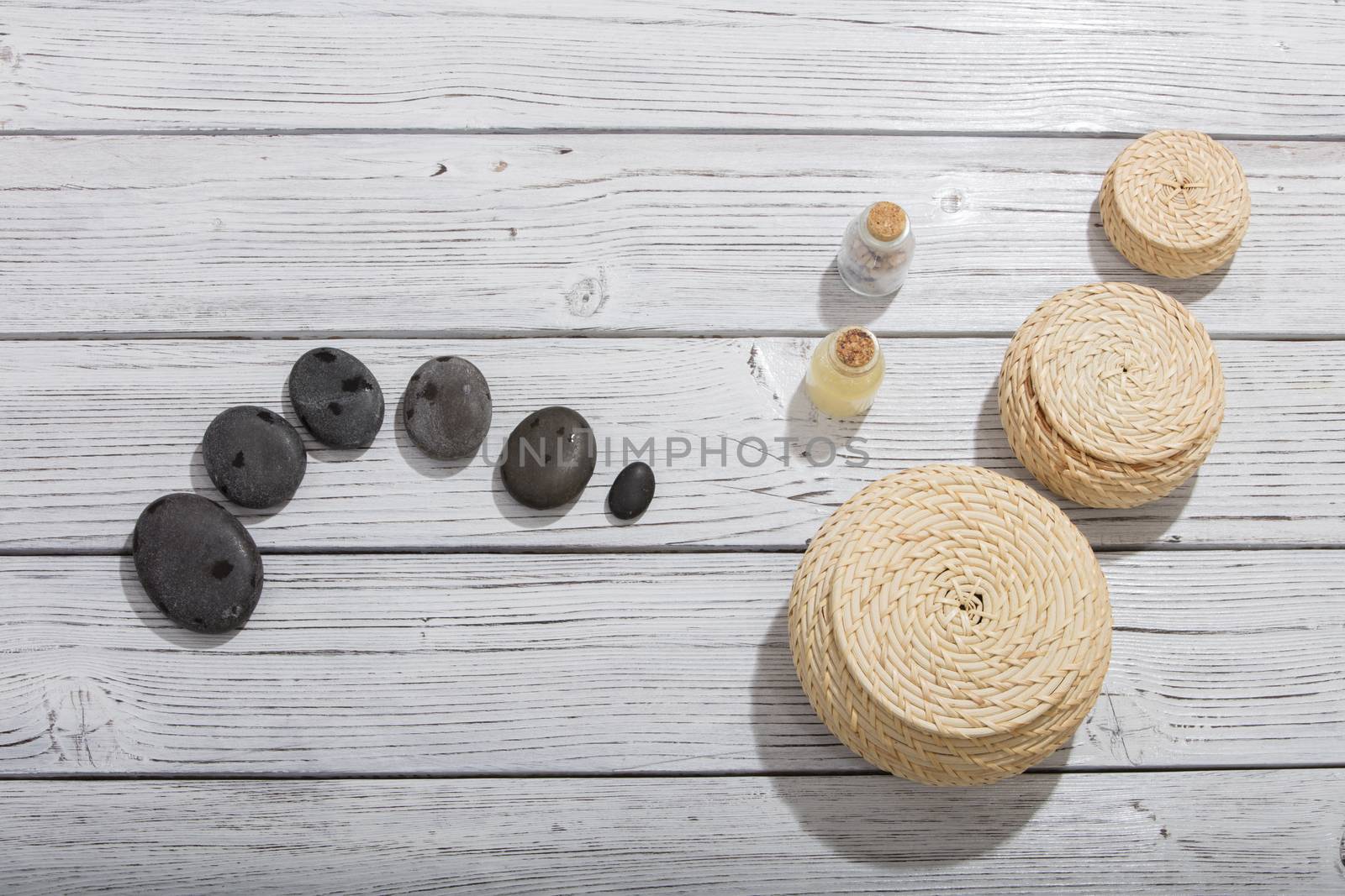 stones for oriental spa massage therapy on wooden background by senkaya