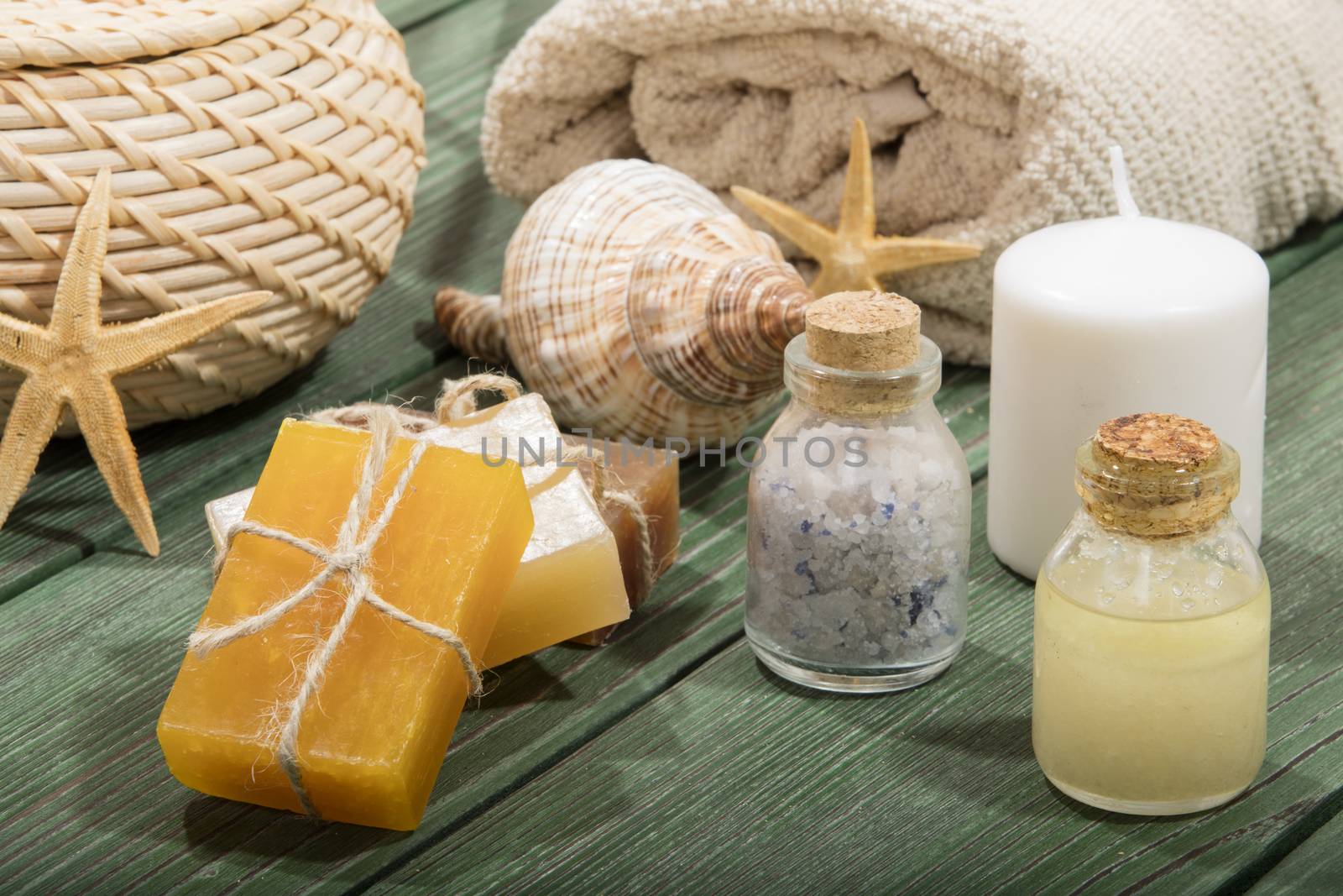 spa setting with essence oil,natural soap,soft towel by senkaya